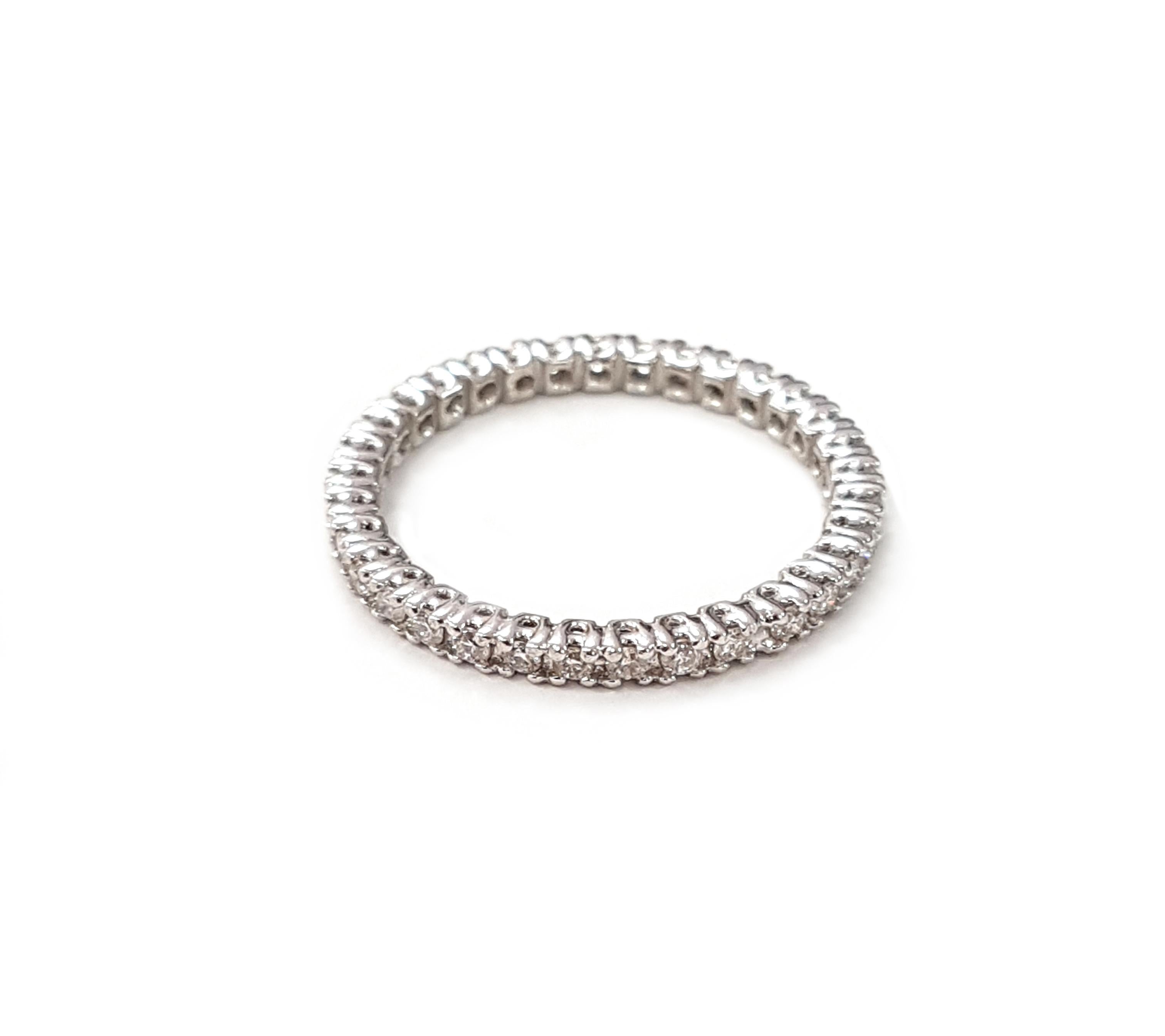 An 18-karat white gold and diamond eternity ring with round-cut, white diamonds. A sleek and understated style that will last a lifetime, this ring adds serious sparkle to your stack or sits beautifully on its own. 

This ring is also available with