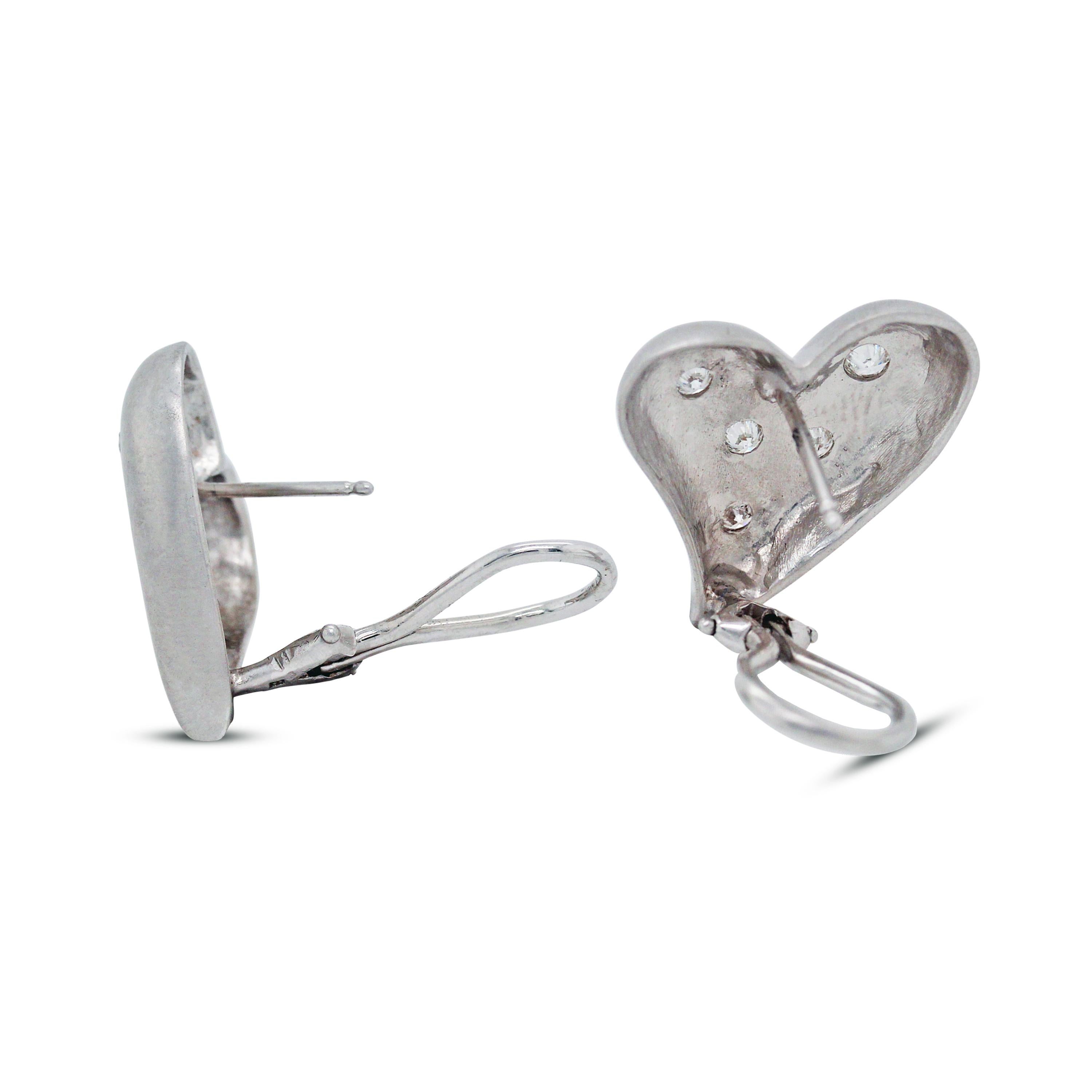 18K White Gold and Diamond Heart Earrings

These brushed-finished, white gold earrings feature five diamonds in each earring. Total weight, apprx. 0.50 carat diamonds G color, VS clarity

The earrings have a post and omega back for comfortable wear