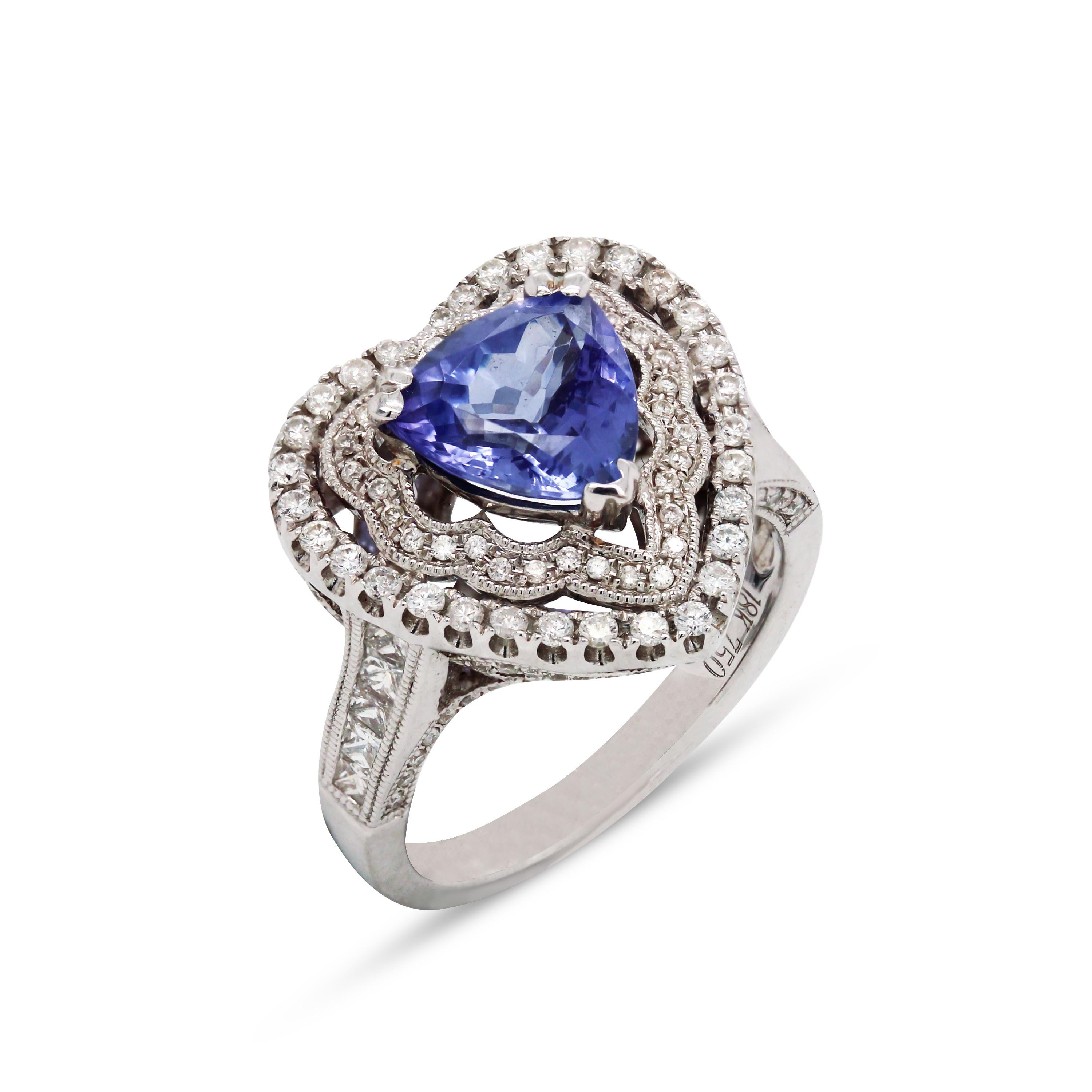 18K White Gold and Diamond Heart Shape Cocktail Ring with Trillion-Cut, Tanzanite Center

This ring features a double-row of diamonds in the center surrounding the Tanzanite

Diamonds are also set half-way on the band.

0.85 carat apprx., H color,
