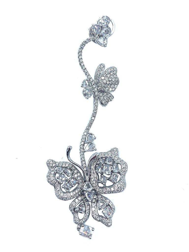 Delicate yet dazzling, these Long Butterfly Dangle Earrings, adorned with sparkling white diamonds, are set in 18 kt white gold. This whimsical dangle measures 3.5 inches in length, with the bottom butterfly width measuring 1 inch.

