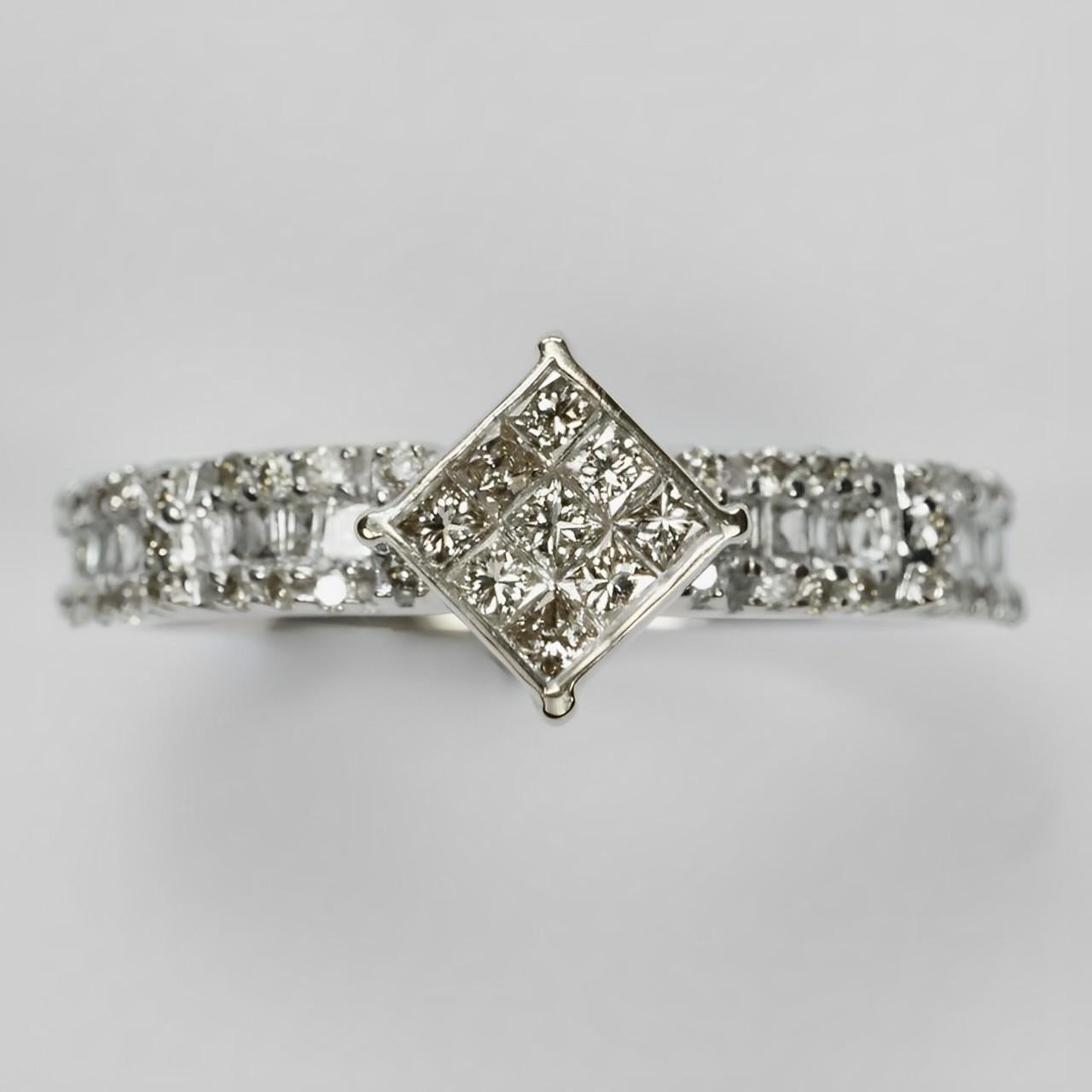 Beautiful 18K white gold ring, featuring a 9 diamond pavé design, with 18 baguette diamonds and 40 round diamonds decorating the shoulders. Ring size UK M 1/2,  US 6 1/4,  inside diameter 1.75 cm / .68 inch. The diamond pavé measures diameter 5.5 mm