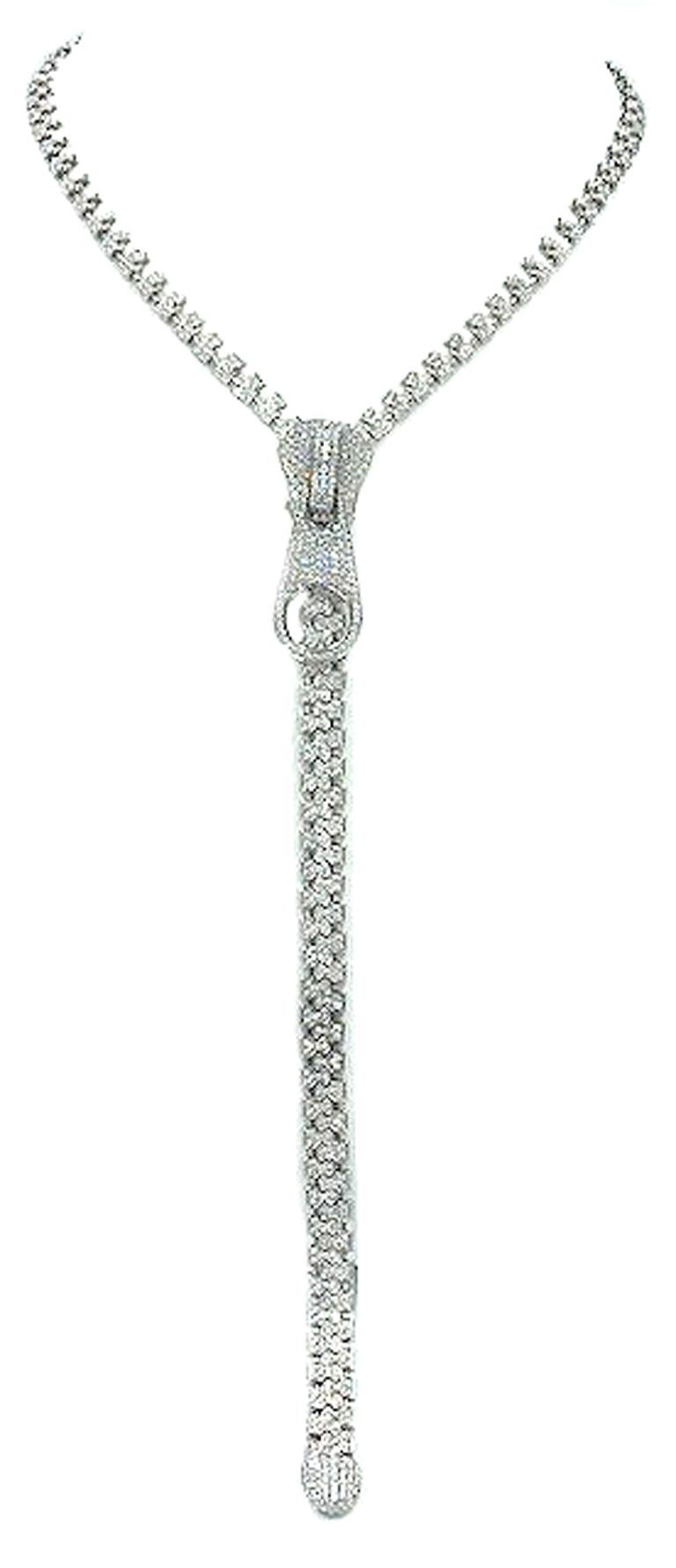 Inspired by the famous zipper necklaces created by famous jewelry houses. This 18k white gold and diamond zipper necklace measures 27 inches in length and sparkles with 7.20cts of white diamonds. The beauty of this necklace is that the zipper is