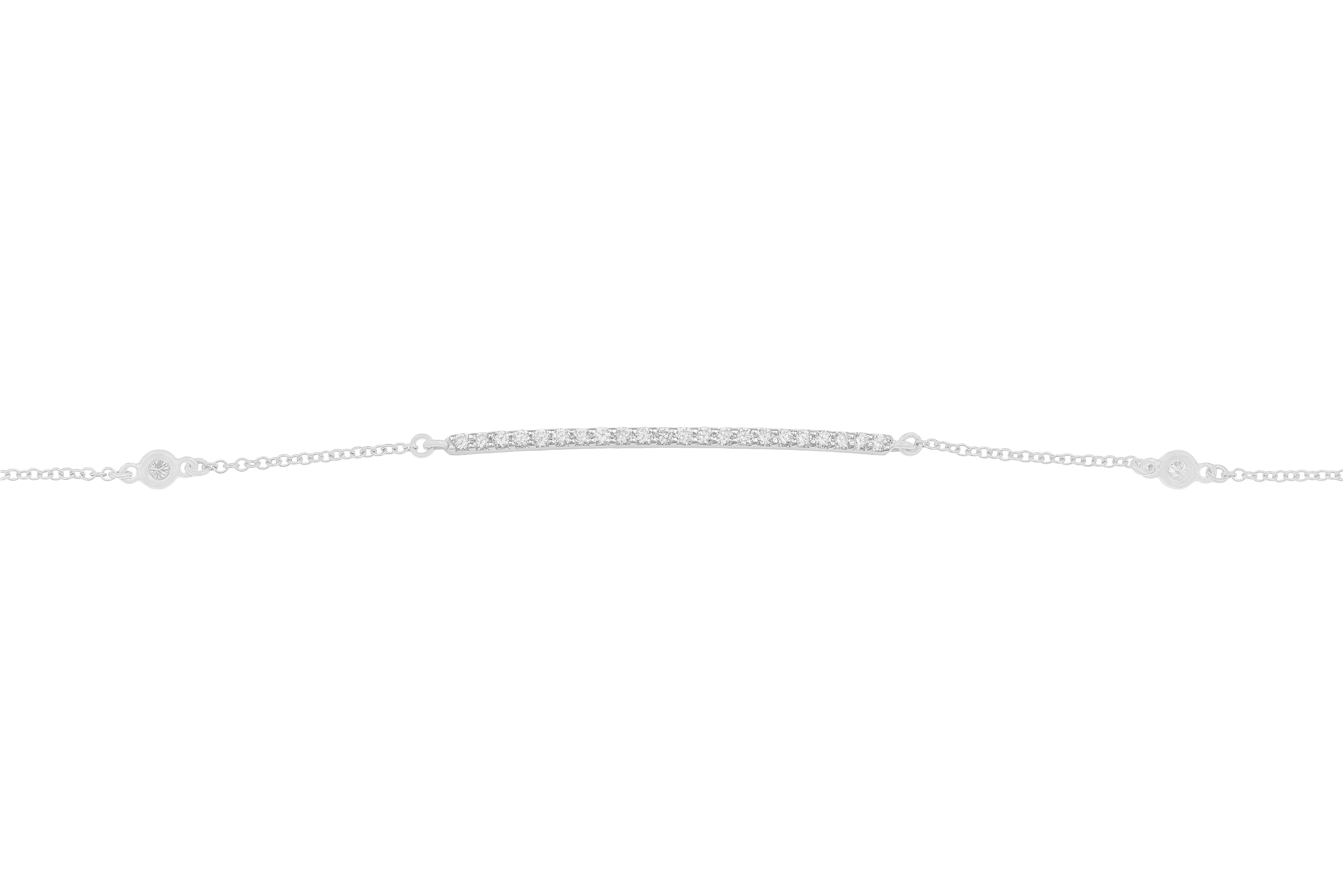 This 18k white gold bracelet with white diamonds is made in Italy by Fanuele Gioielli.    
It features a row of brilliant cut white diamonds set in a white gold bar, and three more brilliant cut white diamonds inserted in a white gold frame.
Nine