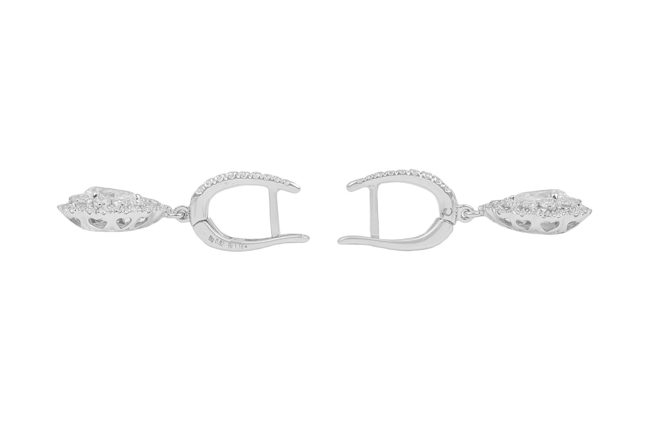 These elegant and bright 18K white gold drop earrings are made in Italy by Crivelli.
They feature a central pear cut diamond surrounded by brilliant cut diamonds set all over the front side of the setting.
Diamonds total content is 2.0ct
18k white