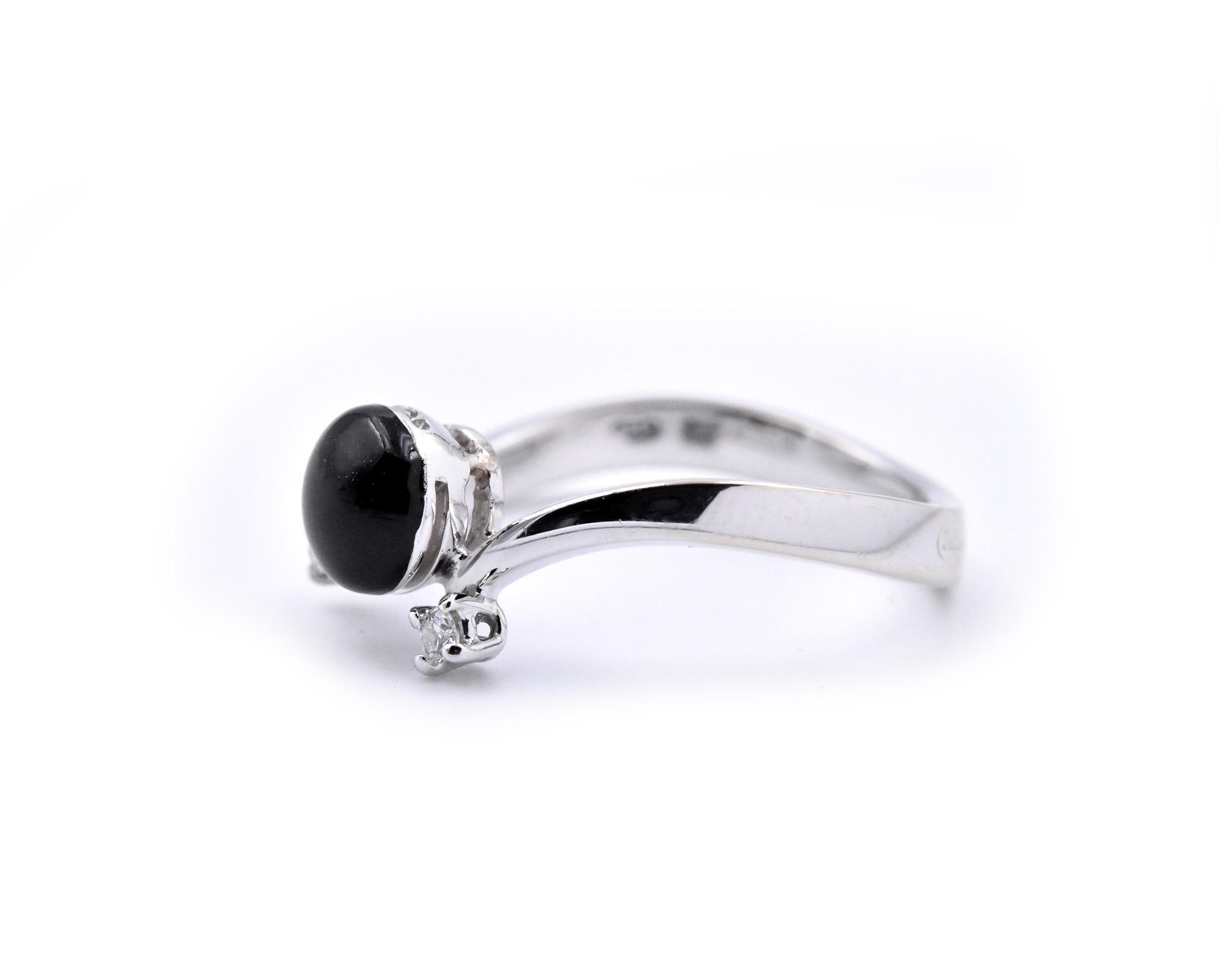 Designer: custom design hallmarked “Dol Lago”
Material: 18k white gold and sterling silver, black enamel
Diamonds: 2 round brilliant cuts = 0.05cttw
Ring Size: 6 ¾ (please allow two additional shipping days for sizing requests)
Dimensions: ring top