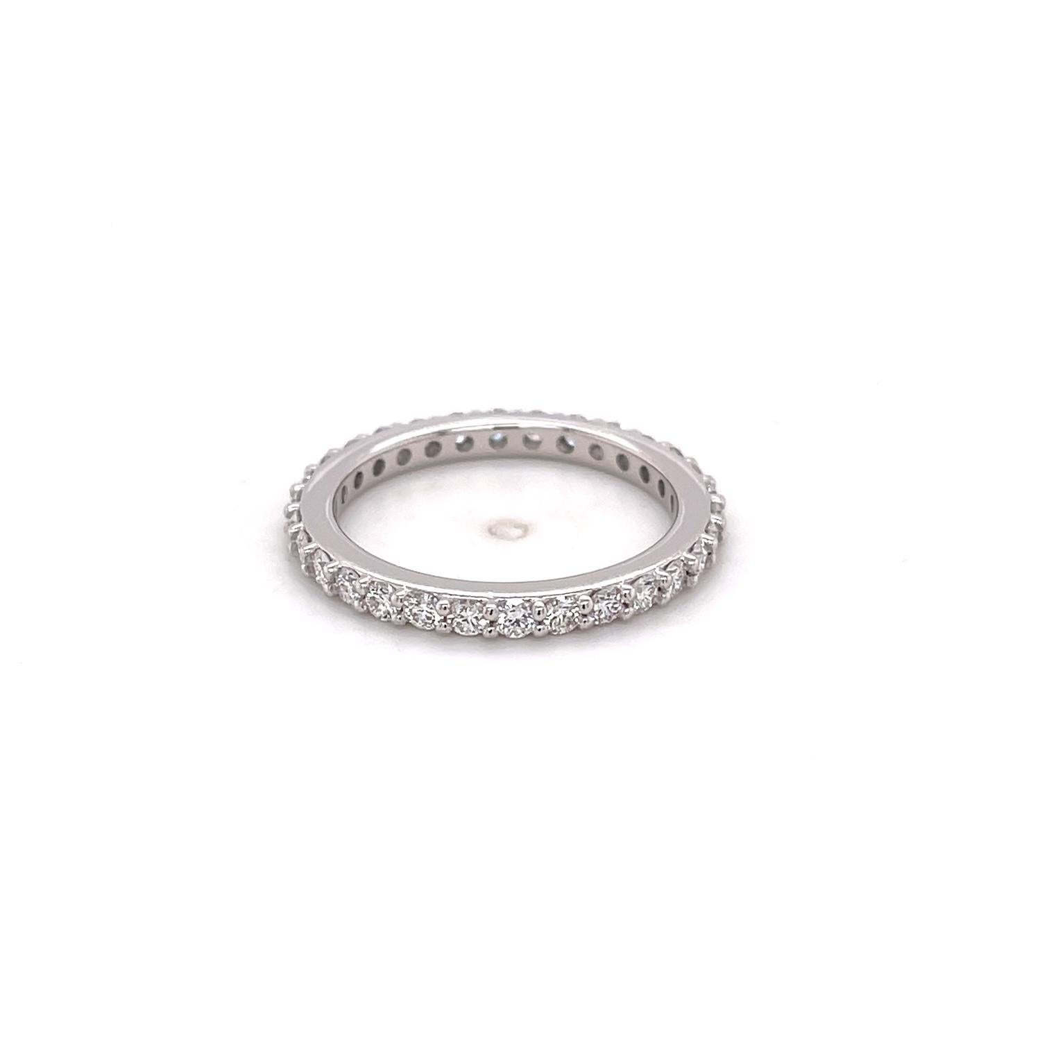 An 18k white gold anniversary band set with 30, 2mm white round F color VS clarity diamonds for a total of .9 total carats. This ring was made and designed by llyn strong.
This ring can be made into any size - price may vary.