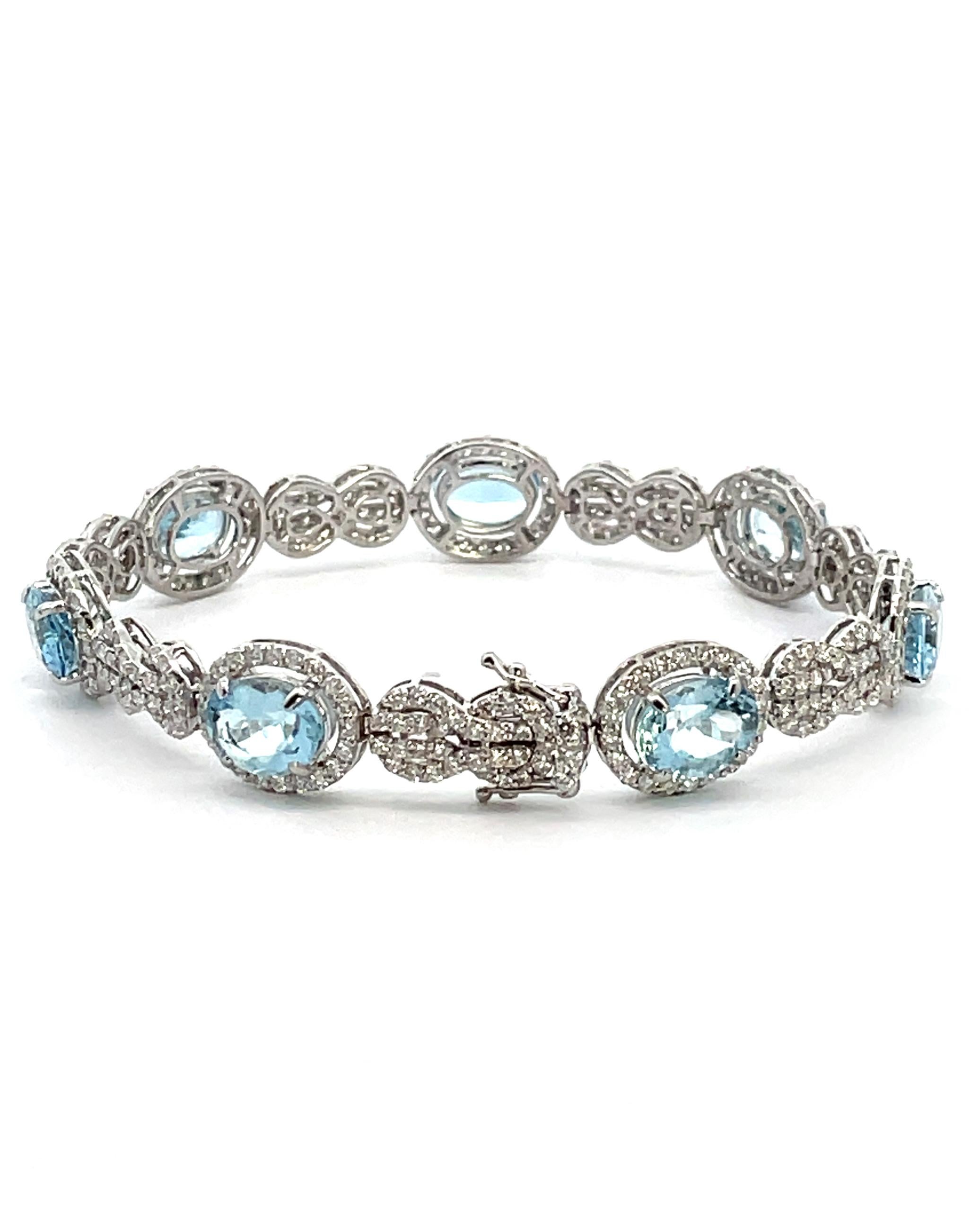 18K white gold bracelet with 7 oval shape aquamarines weighing 10.91 carats total and 360 round diamonds weighing 4.63 carats total.

* Approximately 10.8mm wide
* Oval shaped aquamarines measure about 9x7mm each.
* Diamonds are on average H color,