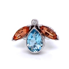 18 Karat White Gold Aquamarine and Precious Topaz Ring with a White Diamond