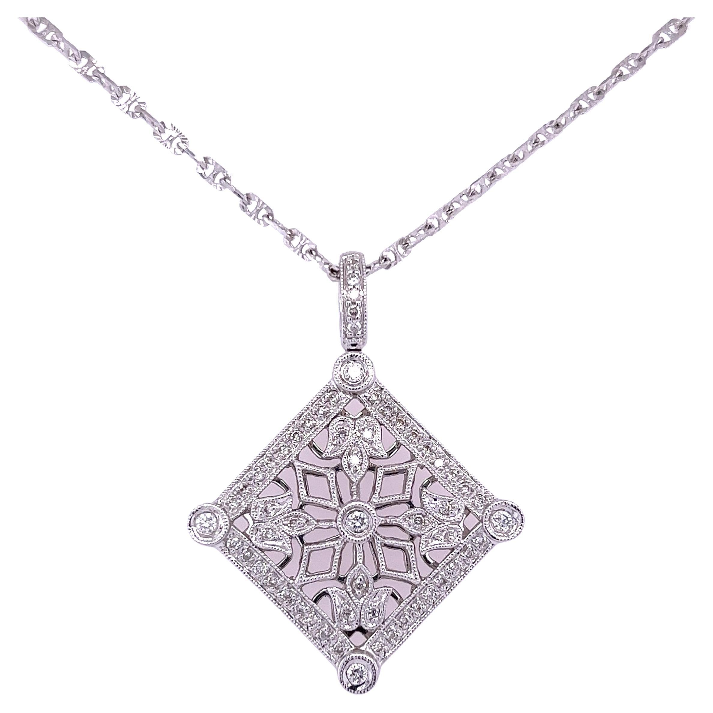 18 karat white gold sets 58 round cut natural diamonds in this Art Deco-inspired pendant. This pendant features the signature Art Deco style with a symmetrical floral pattern motif. Hypoallergenic and 100% waterproof. Ideal for daily wear. 

The