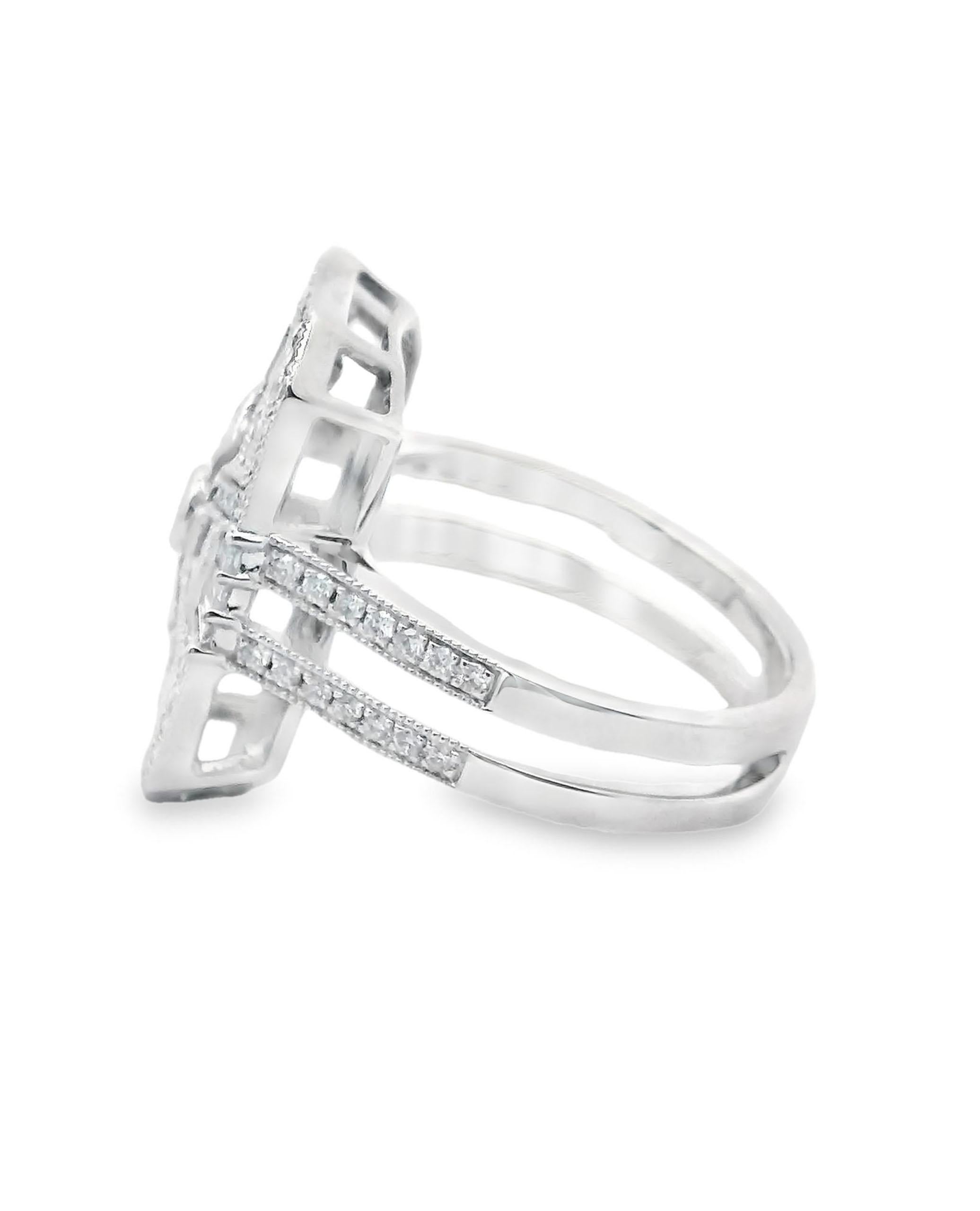18K white gold Art Deco inspired ring with 2 princess cut diamonds weighing 0.05 carat total, 83 round brilliant-cut diamonds weighing 0.54 carat total and 14 tapered baguette diamonds weighing 0.29 carat total.

- Finger size 6.5
- Diamonds are G/H