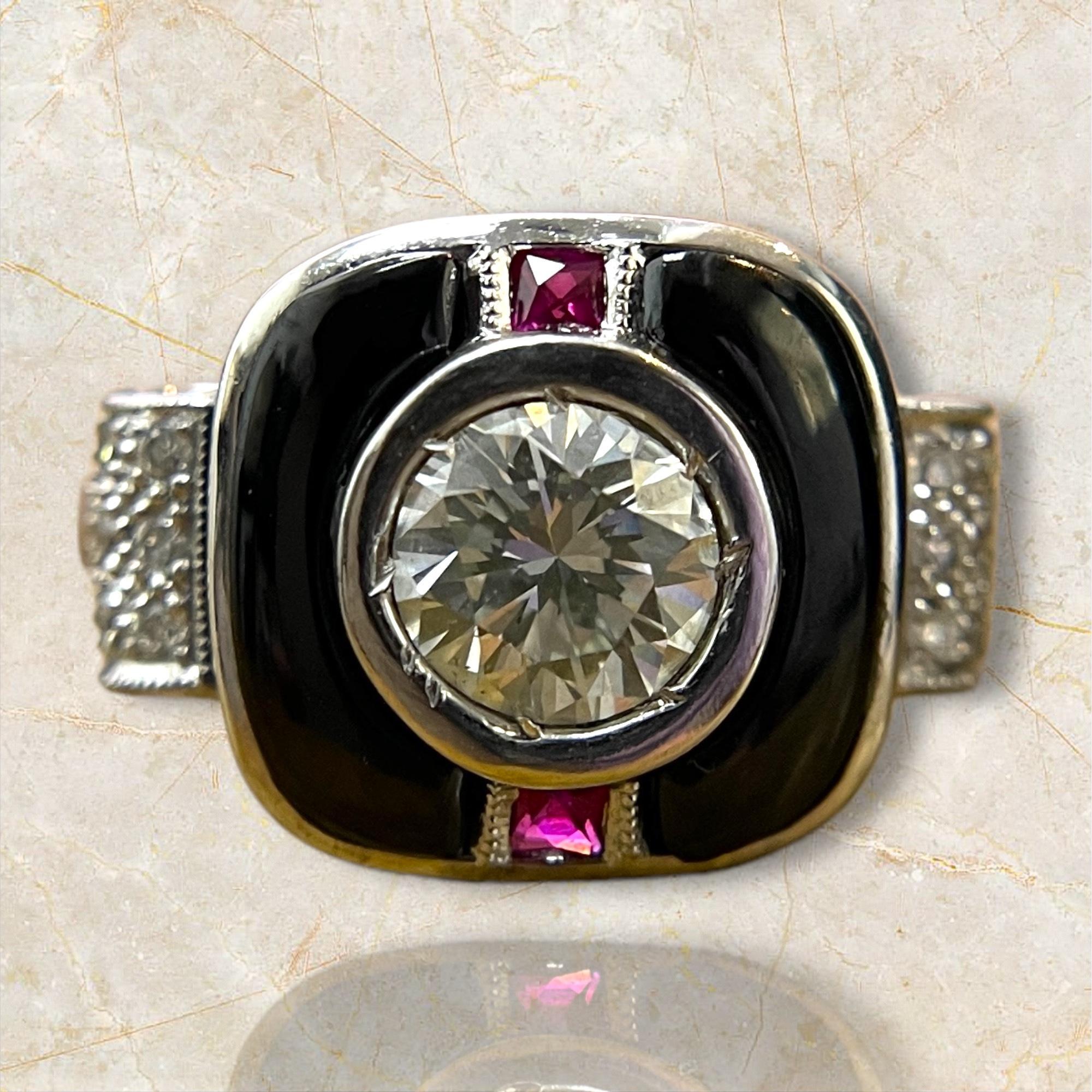 This Art Deco ring features a GIA certified round natural diamond at its center, surrounded by sleek Black Spinel. Accented with vivid rubies and sparkling diamonds, this piece exemplifies vintage elegance and sophisticated design.

Material: 18K