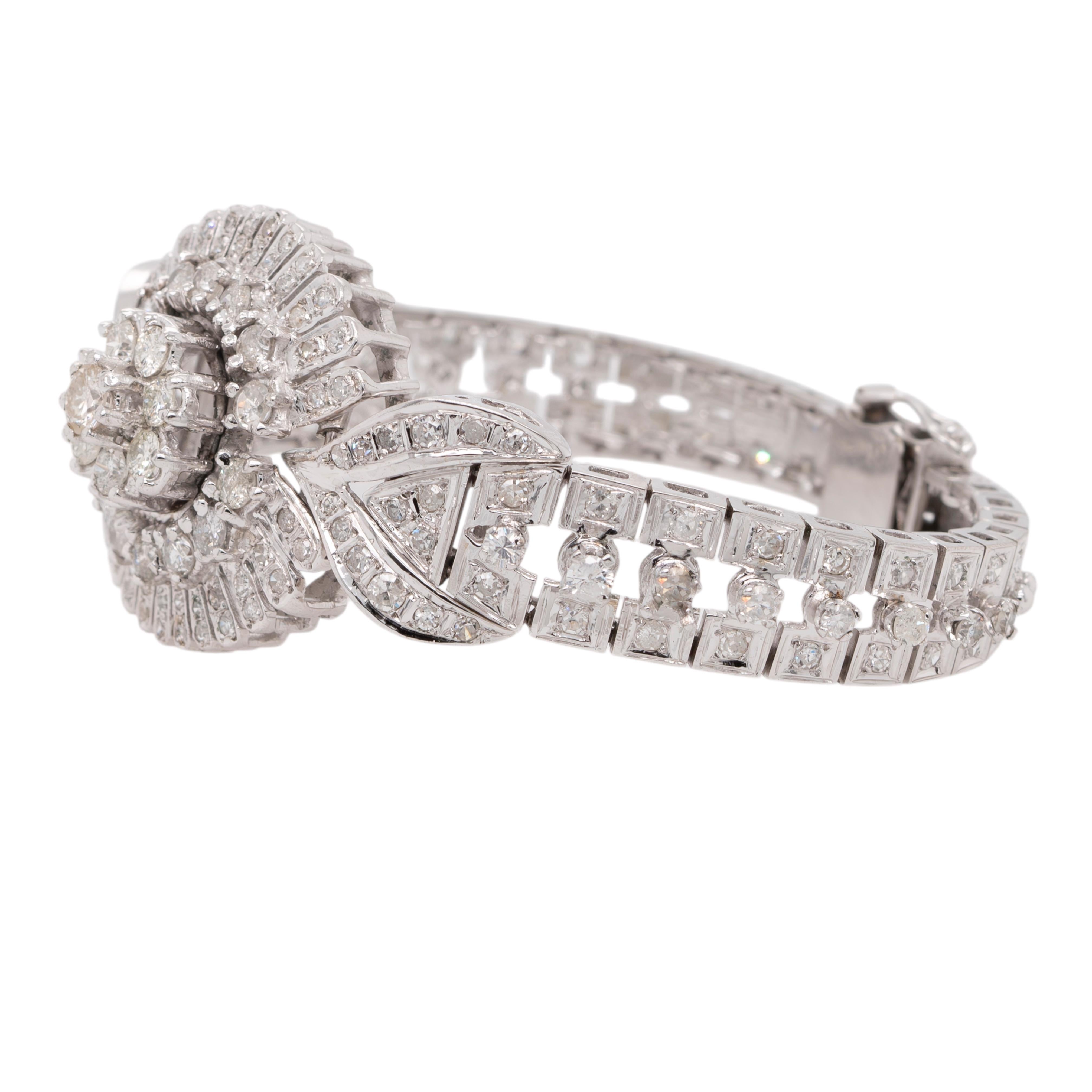 This 18k White Gold Vintage Style Diamond Bracelet features approximately 11ctw of sparkling natural diamonds, offering a stunning and timeless design. Weighing 49.0g (31.5dwt), this bracelet combines vintage elegance with modern luxury. The