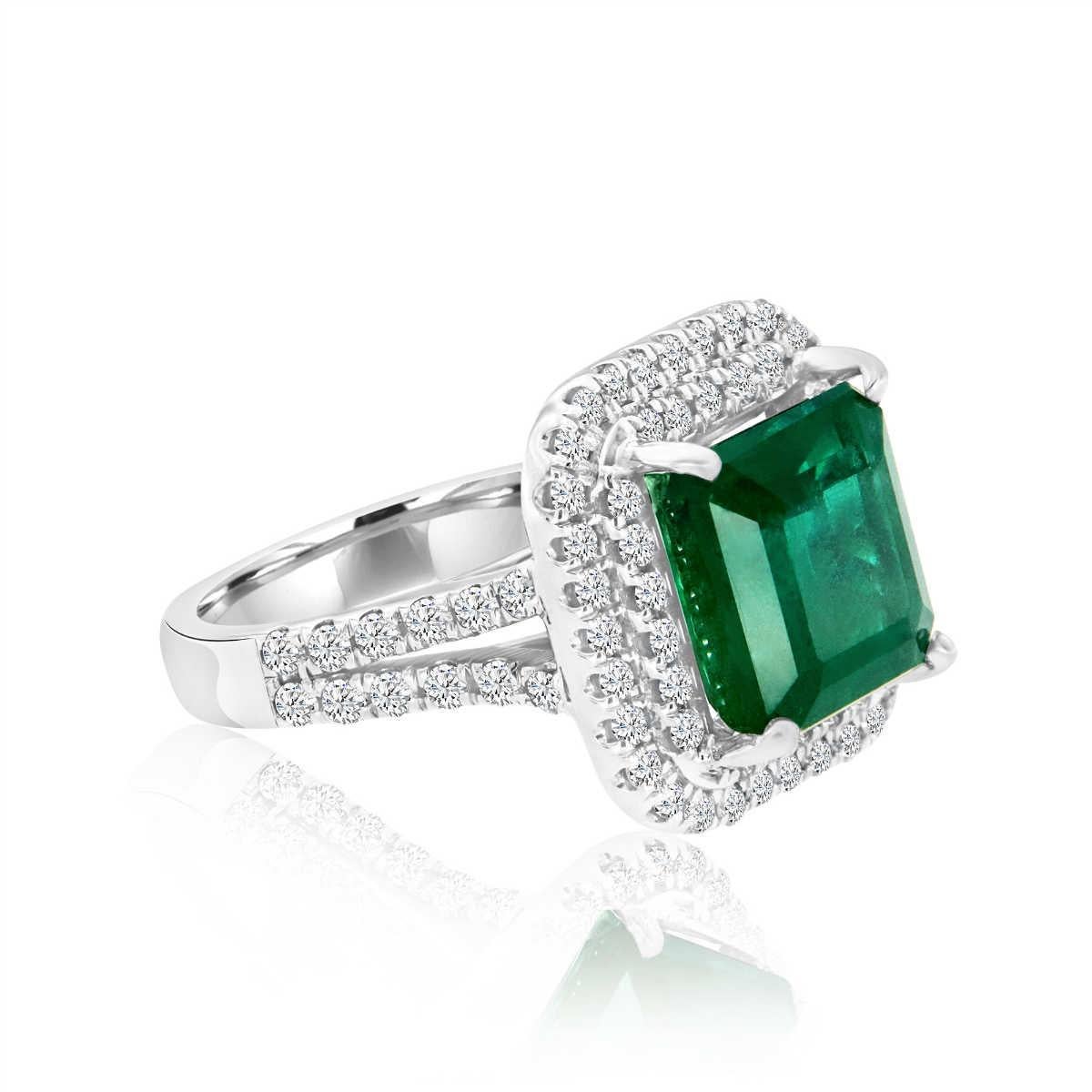 This Red Carpet stunning handcrafted ring features 5.21 Green Natural emerald in premium color. The emerald encircled by two rows of micro-prong set round brilliant diamonds. To complete the glamorous look of this ring, we designed two rows of round