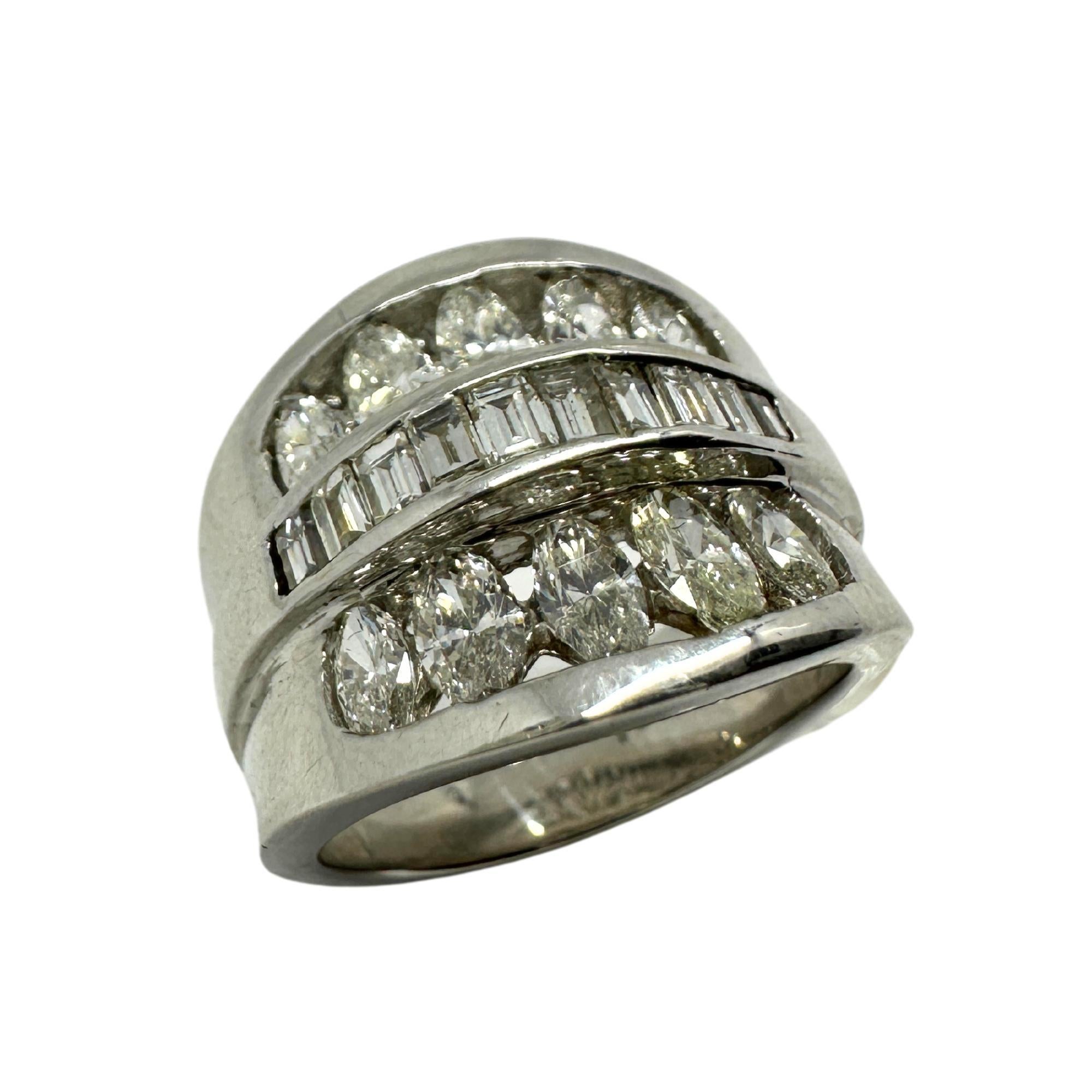 This stunning 18k Baguette and Marquise Cut Diamond Wide Band Ring is crafted with 18k white gold and features a wide band adorned with 0.44 carats of baguette cut diamonds and 1.19 carats of marquise cut diamonds. 

18k White Gold Baguette and