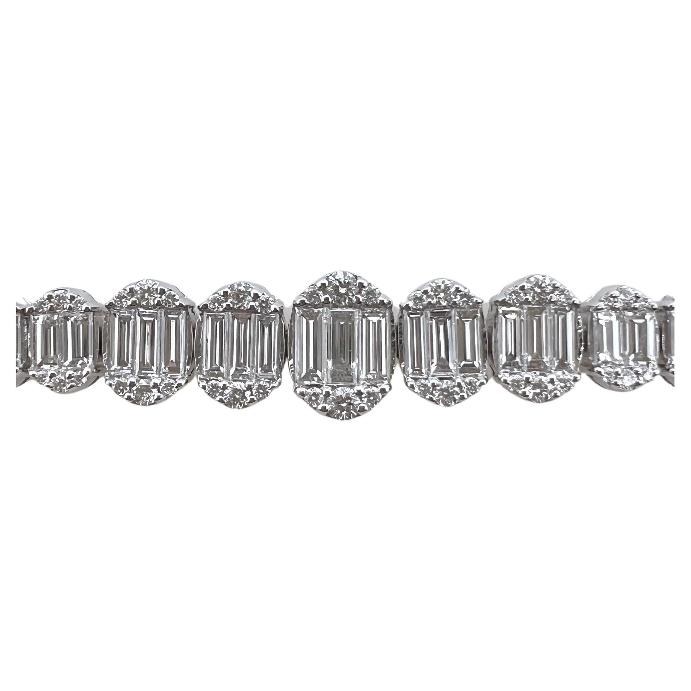 This diamond tennis bracelet is unique and an eye catcher! The baguettes are graduated in the design with the round brilliant diamonds on the outside shoulders. The contrast of the brilliant round diamonds against the crisp, white baguettes is