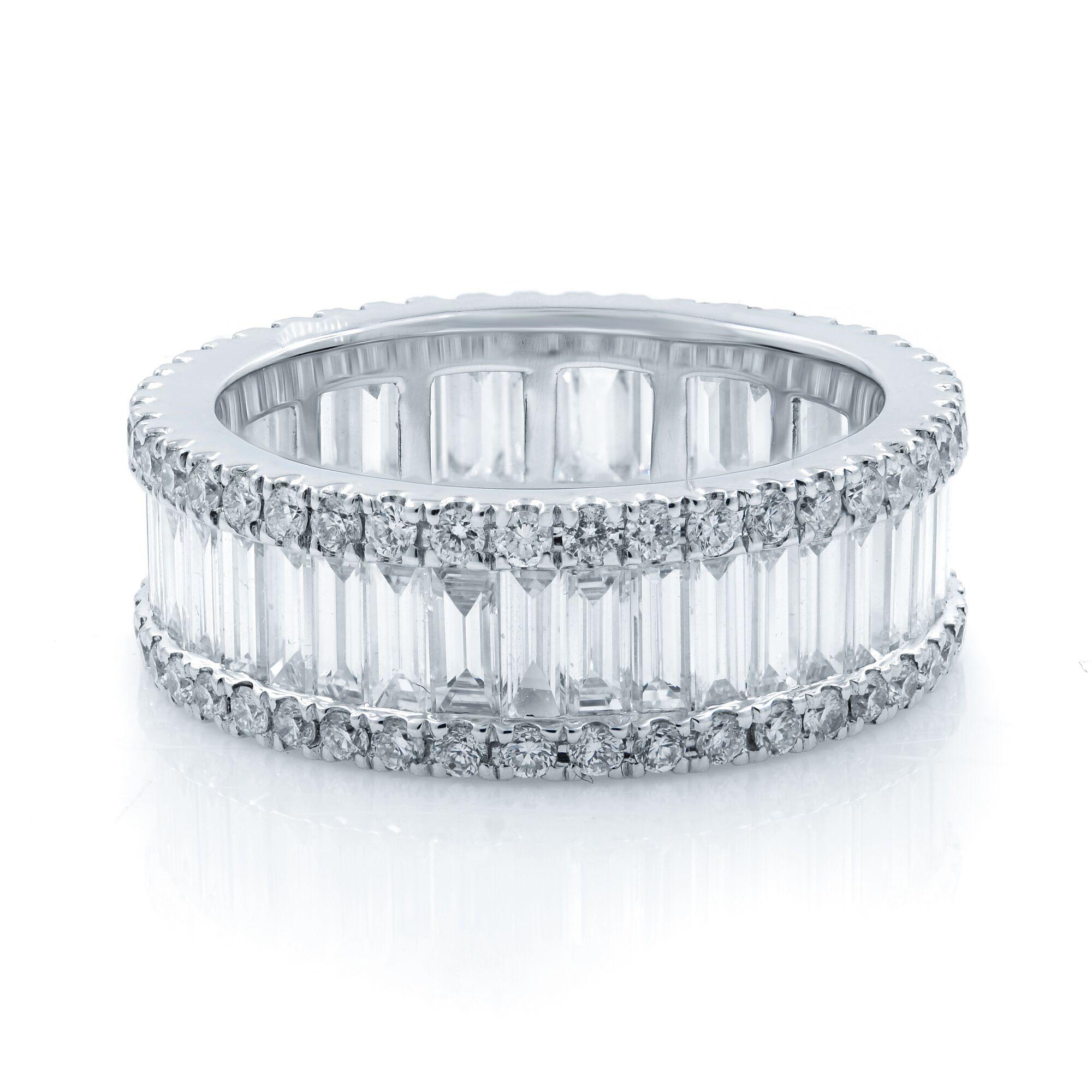 The channel set full eternity was crafted with hand selected baguette cut and round pave cut diamonds weighing 3.15 carats in total. Beautifully set in 18K white gold.
Ring weight 5.34 grams. Size 5.5. Ring width is 6.74mm. This is a stunting band,