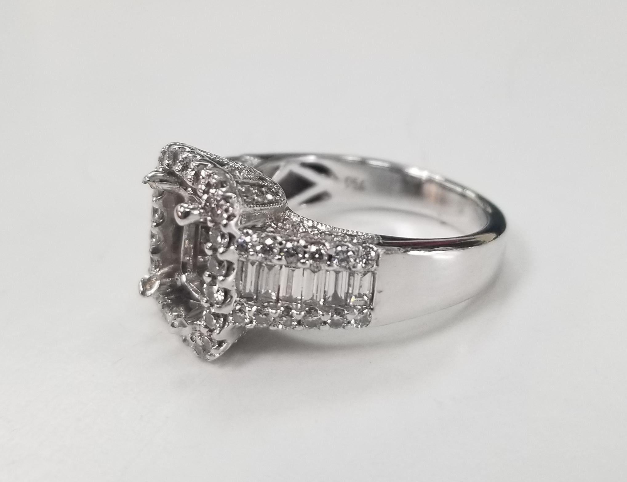 18k white gold baguette and round diamond halo ring, containing set with 12 baguette cut diamonds weighing .50pts. and 76 round full cut diamonds weighing .75pts. color 