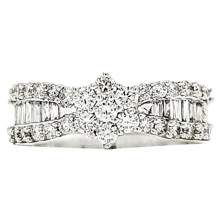 Bague de fiançailles en or blanc 18 carats taille baguette Cts 0,65 et diamants ronds Cts 0,53