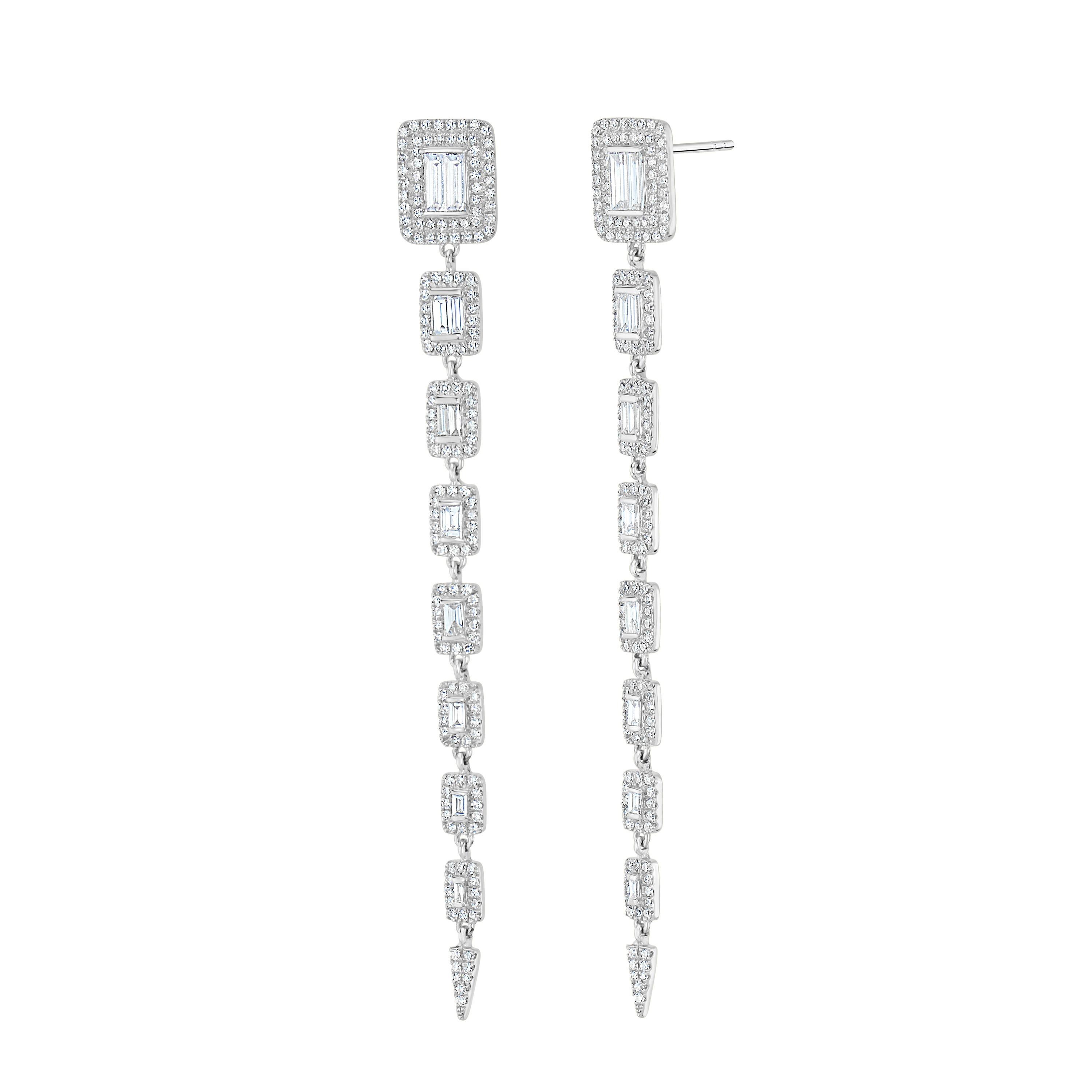 Make a stunning statement when you wear these Luxle earrings, which feature a gleaming stream of baguettes framed in round diamonds arranged in graduated rectangular patterns that down the drop in gleaming 18K white gold.
Please follow the Luxury