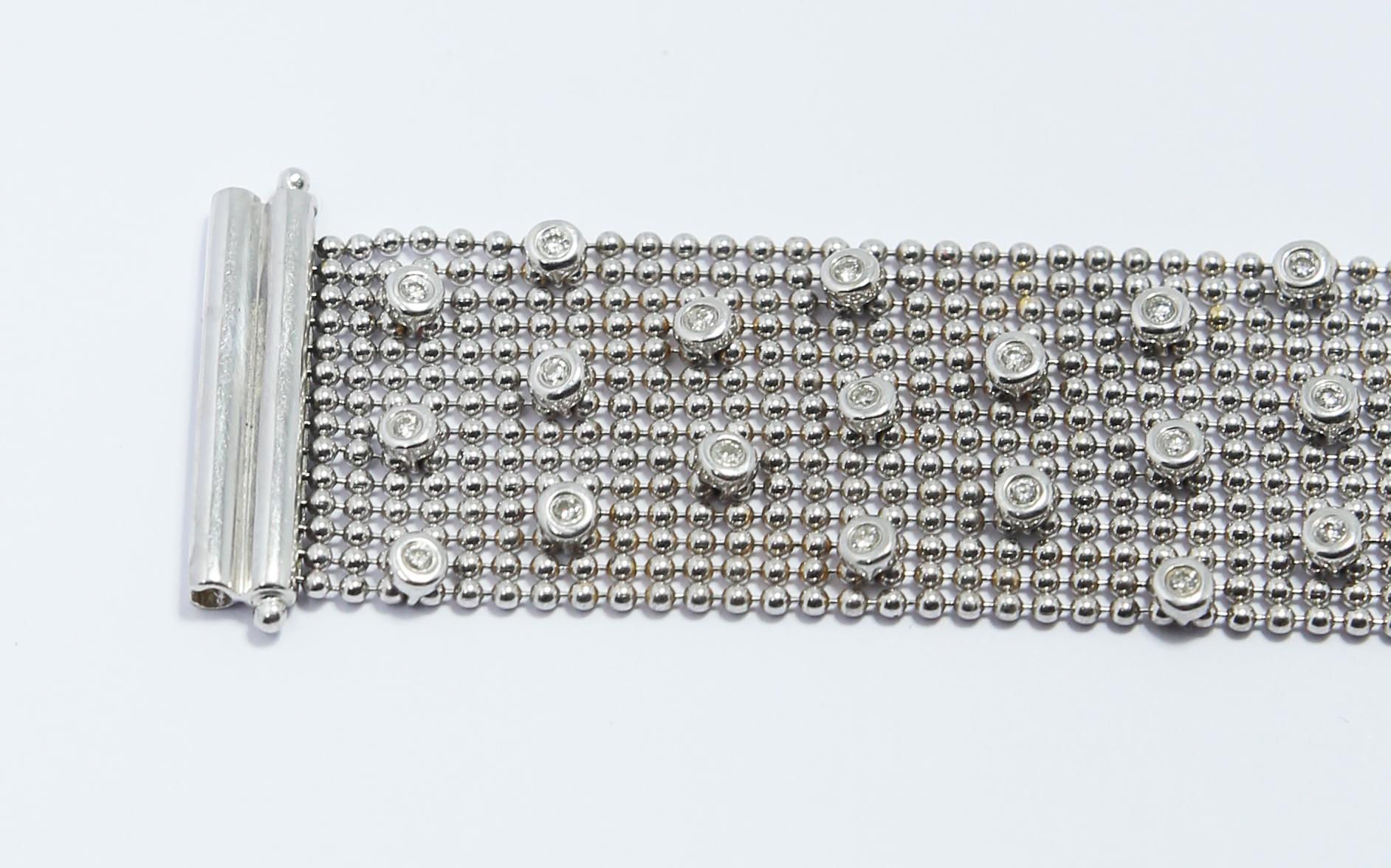 Sleek and sexy white gold diamond bracelet, sleek feeling with the ball chain and sexy with the 58 diamonds in large setting 
Solid closure with two safety brooches 
Length 18 cm // 7.08inches 
Weight 34grams 