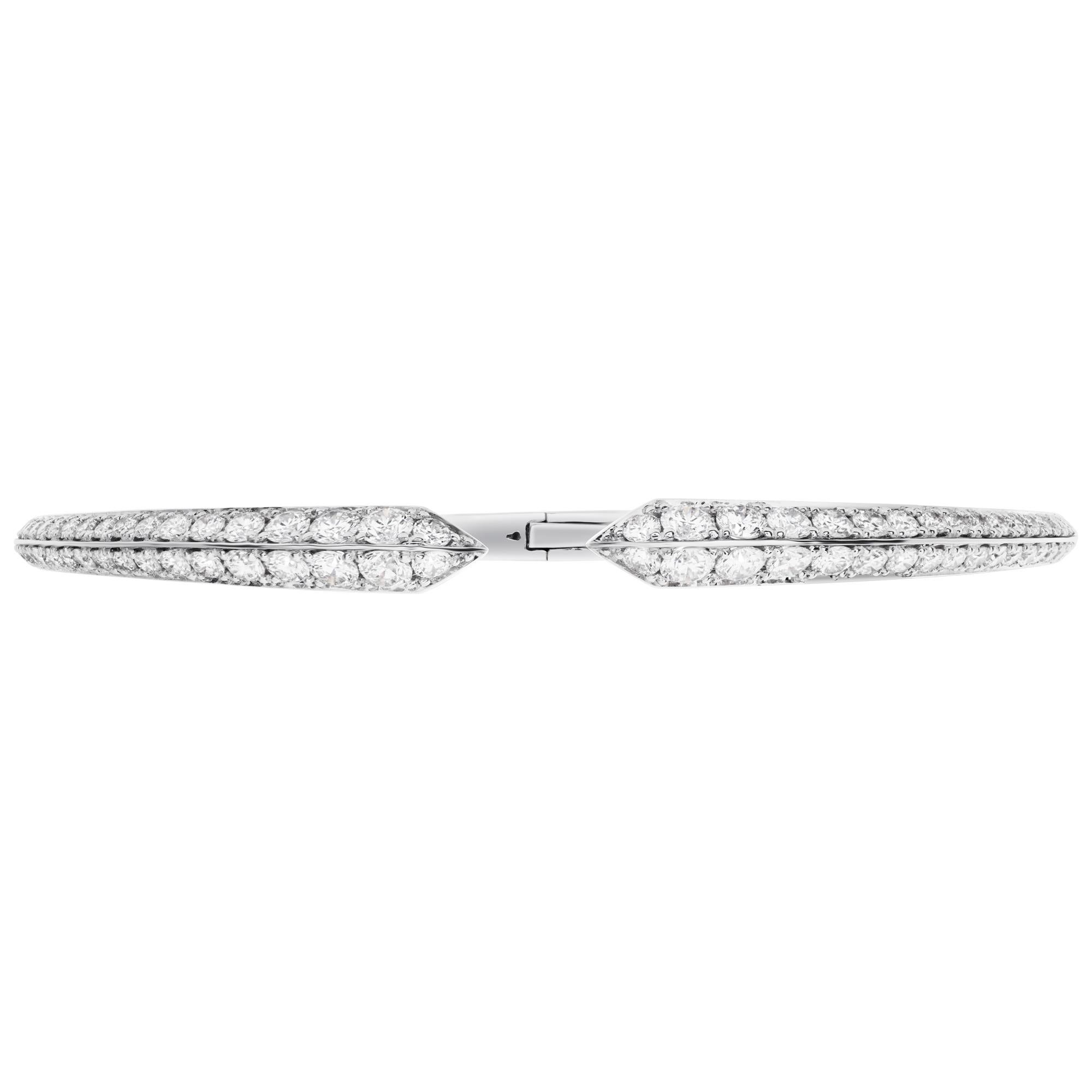 Stunning 18k white gold bangle with 2.36 carats in graduating brilliant round cut diamonds. Fits up to 7.5'' wrist.