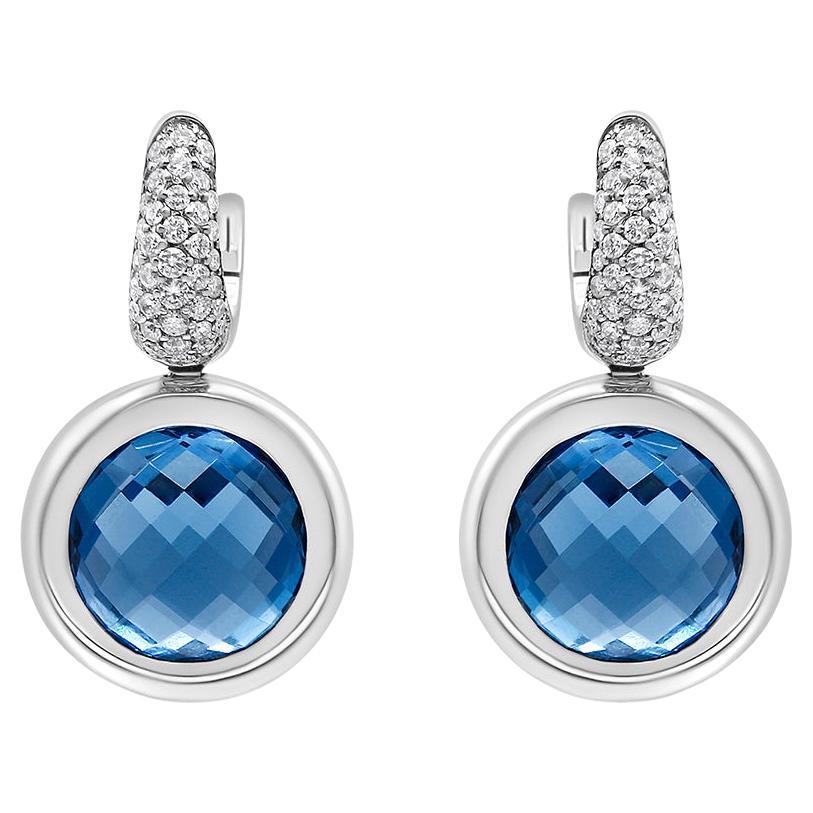 18K White Gold Bezel Set Blue Topaz and 1/2 Carat Diamond Bale Dangle Earrings For Sale