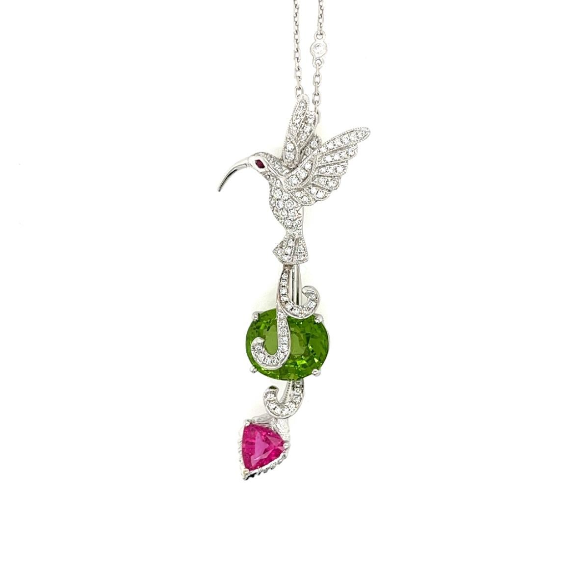18K White Gold Bird & Stone Necklace with Diamonds 

89 Diamonds - 0.48 CT
1 Peridot - 8.04 CT
1 Tourmaline - 1.08 CT
1 Ruby - 0.02 CT
18K White Gold - 7.80 GM

This exquisite necklace features a unique and captivating design that combines the