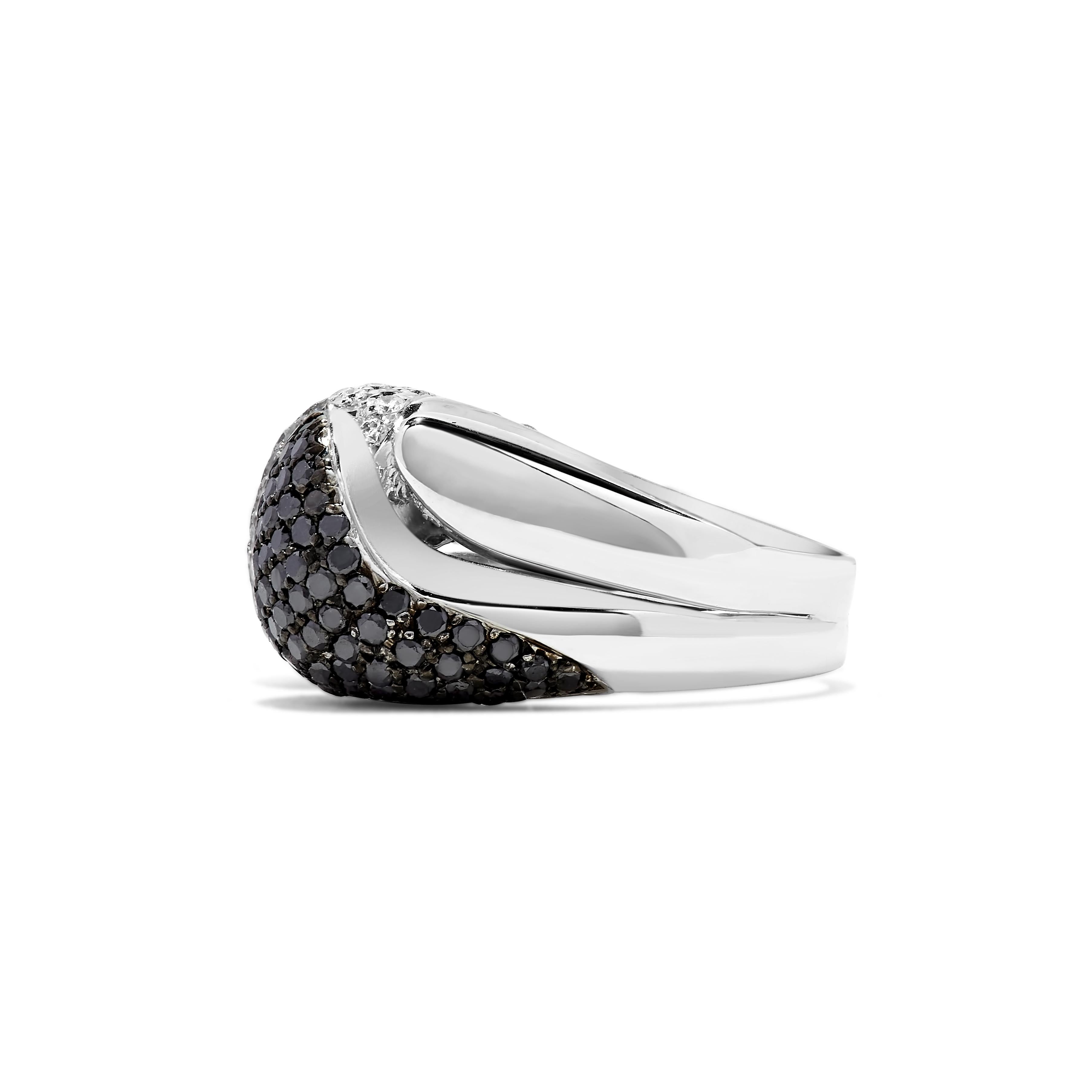This cocktail ring features approximately 0.50 carats of black and white diamonds set in 18K white gold. 