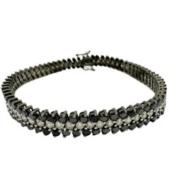 Bracelet tennis en or blanc 18 carats avec diamants noirs et blancs