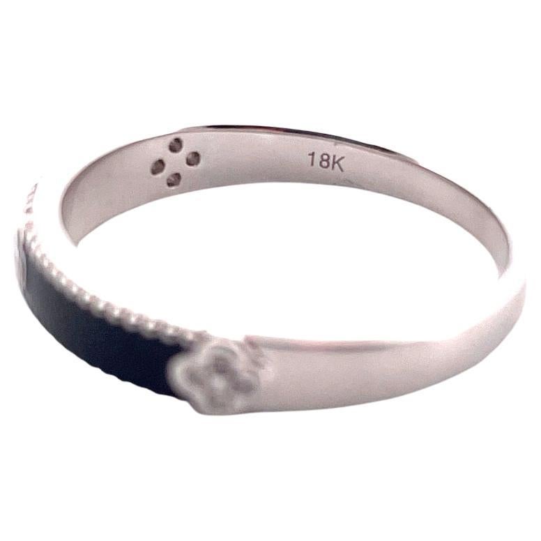18k White Gold Black Enamel Diamond Ring

This stunning 18k white gold ring features a beautiful black enamel design, accentuated with 12 No, 0.07cts diamonds.Weighing 2.7 grams, this ring is comfortable for everyday wear.The white enamel design