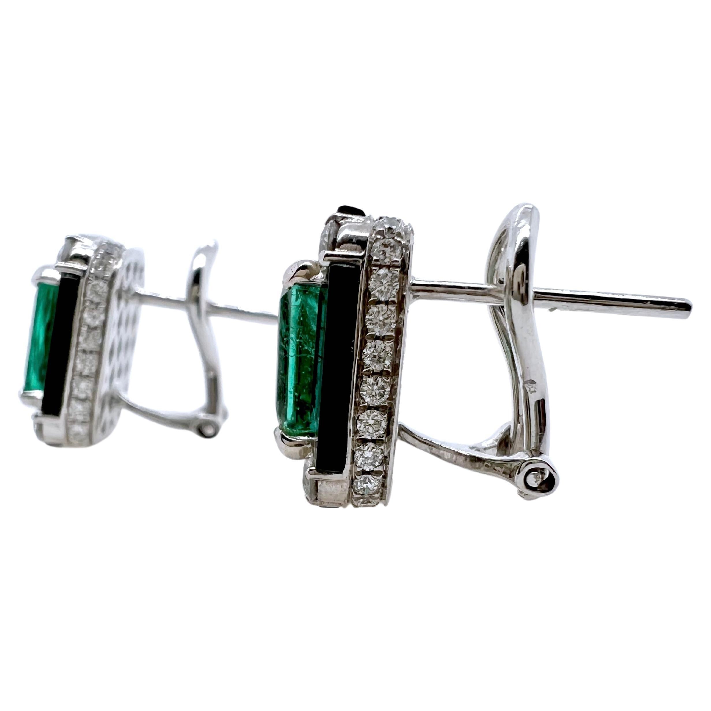 These stunning art deco looking earrings are amazing!  The custom cut black onyx surround the vibrant emeralds and have small pave' diamonds surround the 18k white gold frame.  The size is perfect for the smart casual look!  The contrast of the