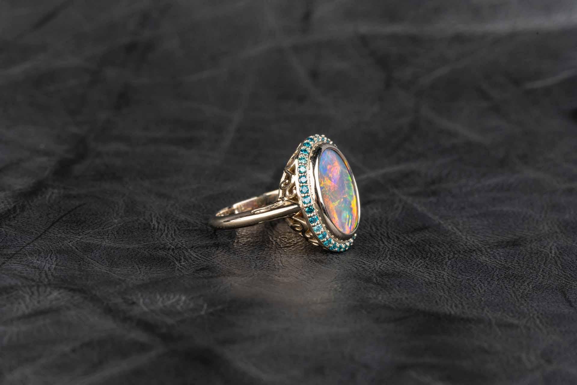 18 Karat White Gold Black Opal Ring with Teal Blue Diamond Halo In New Condition In Greenville, SC