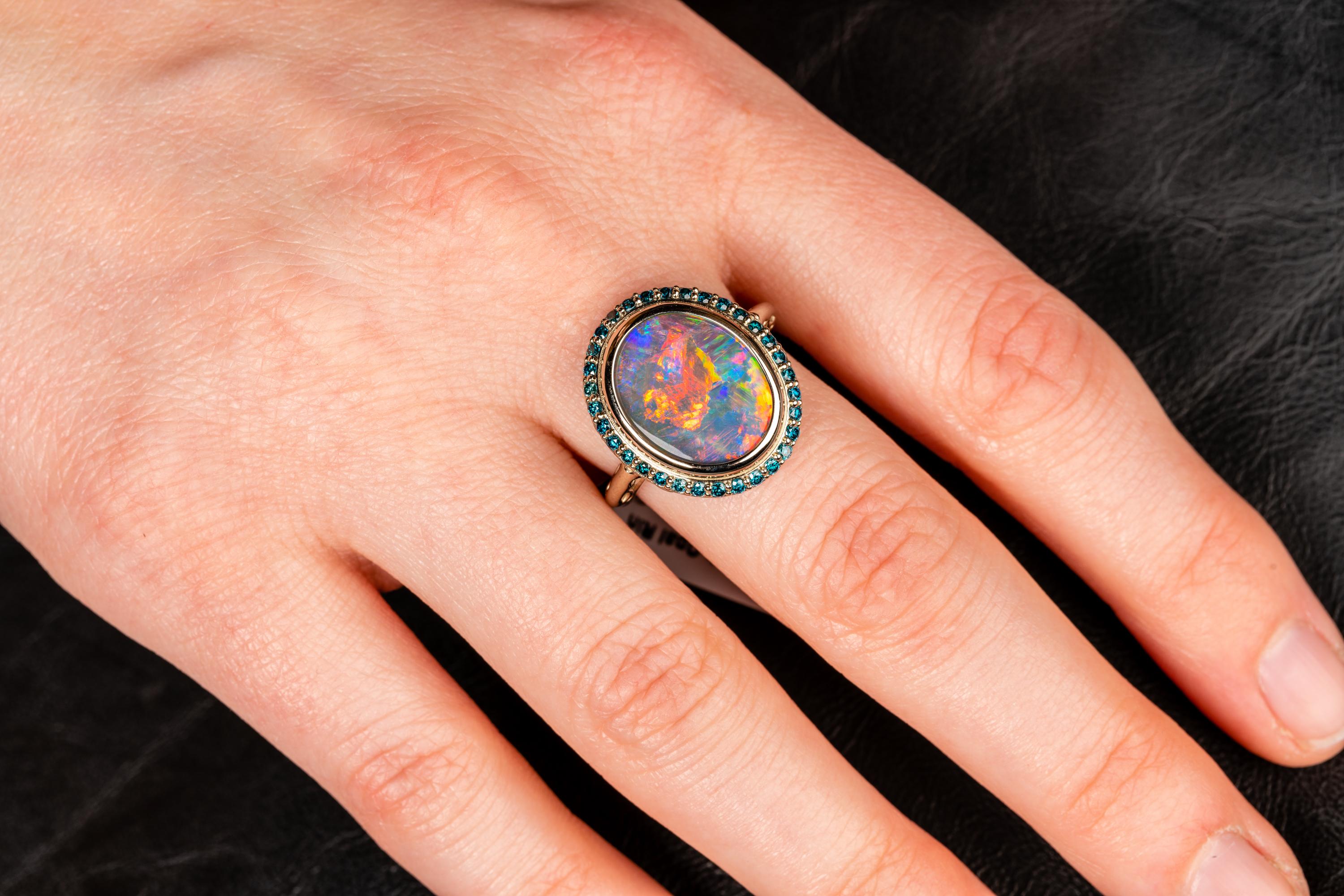 Women's 18 Karat White Gold Black Opal Ring with Teal Blue Diamond Halo