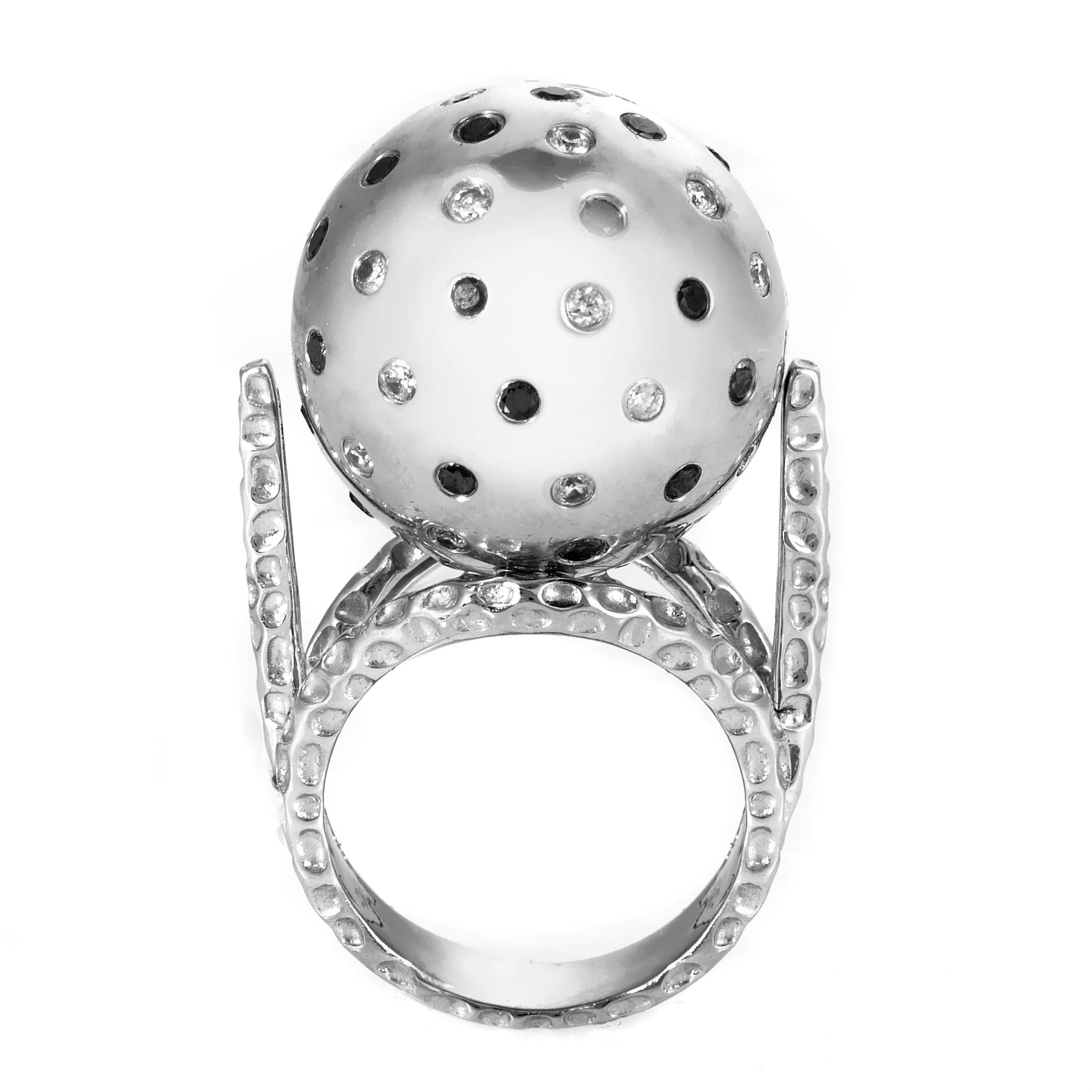 Avant-garde and abstract are the perfect words to describe this highly artistic cocktail ring. The ring is made of 18K white gold and boasts a large spherical accent studded with ~.75ct of black and white diamonds.
Ring Size: 7.0