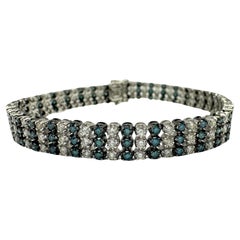 Bracelet en or blanc 18k avec diamants bleus et blancs