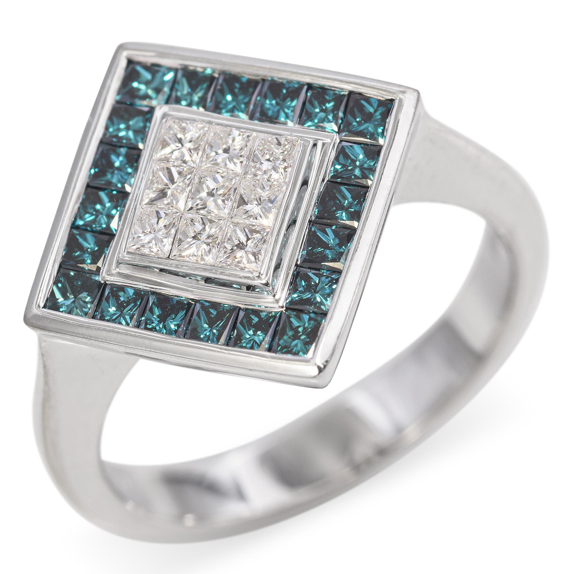 A striking Geometric Diamond Ring, featuring a central square of 0.13ct White Diamonds, encircled by 0.24ct Blue Diamonds, all invisibly set in 18k White Gold. Hidden beneath the setting, a flower motif extends from the shank, an unseen yet