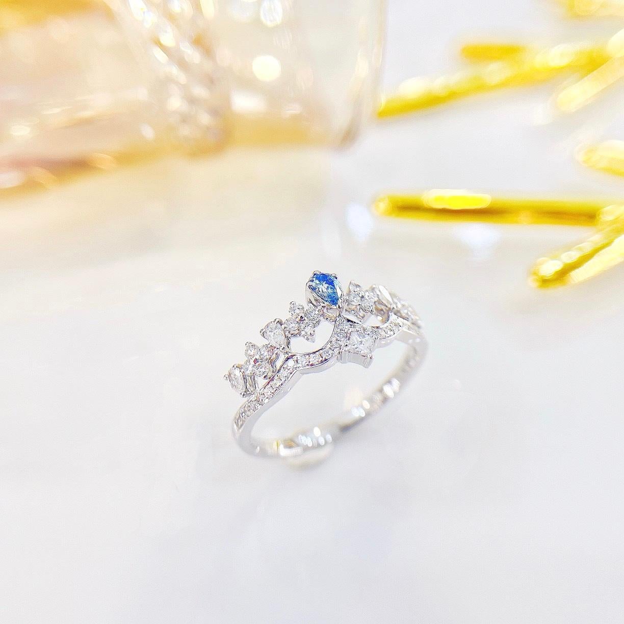 Modern 18K White Gold Blue Diamond Crown Ring with Diamonds For Sale