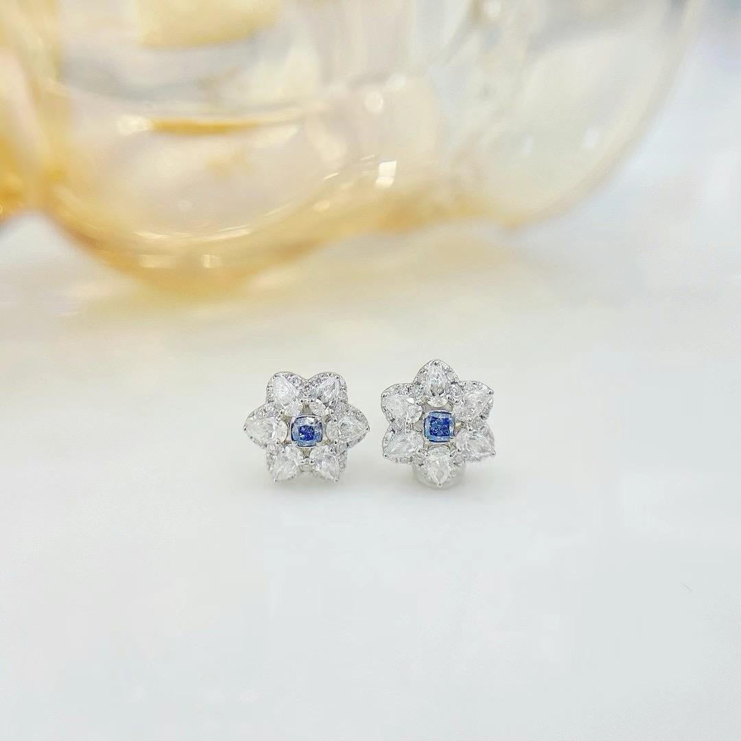 18K White Gold Blue Diamond & Diamond Hexagram Stud Earrings

1 Blue Diamonds - 0.12 CT
Diamonds - 0.72 CT
Total Weight - 2.05 GM

Introducing our exquisite 18K White Gold Blue Diamond & Diamond Hexagram Stud Earrings. Featuring a stunning hexagram