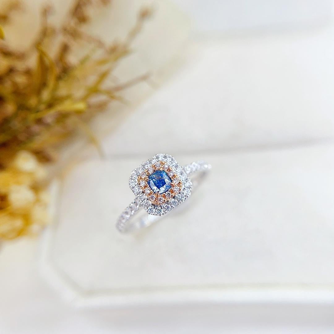 18K White Gold Blue Diamond Halo Ring with Natural Diamonds

These elegant 18K white gold stud earrings are designed with a unique two-tone cushion-shaped setting. Featuring natural yellow and white diamonds (0.34ct), they exude sophistication and