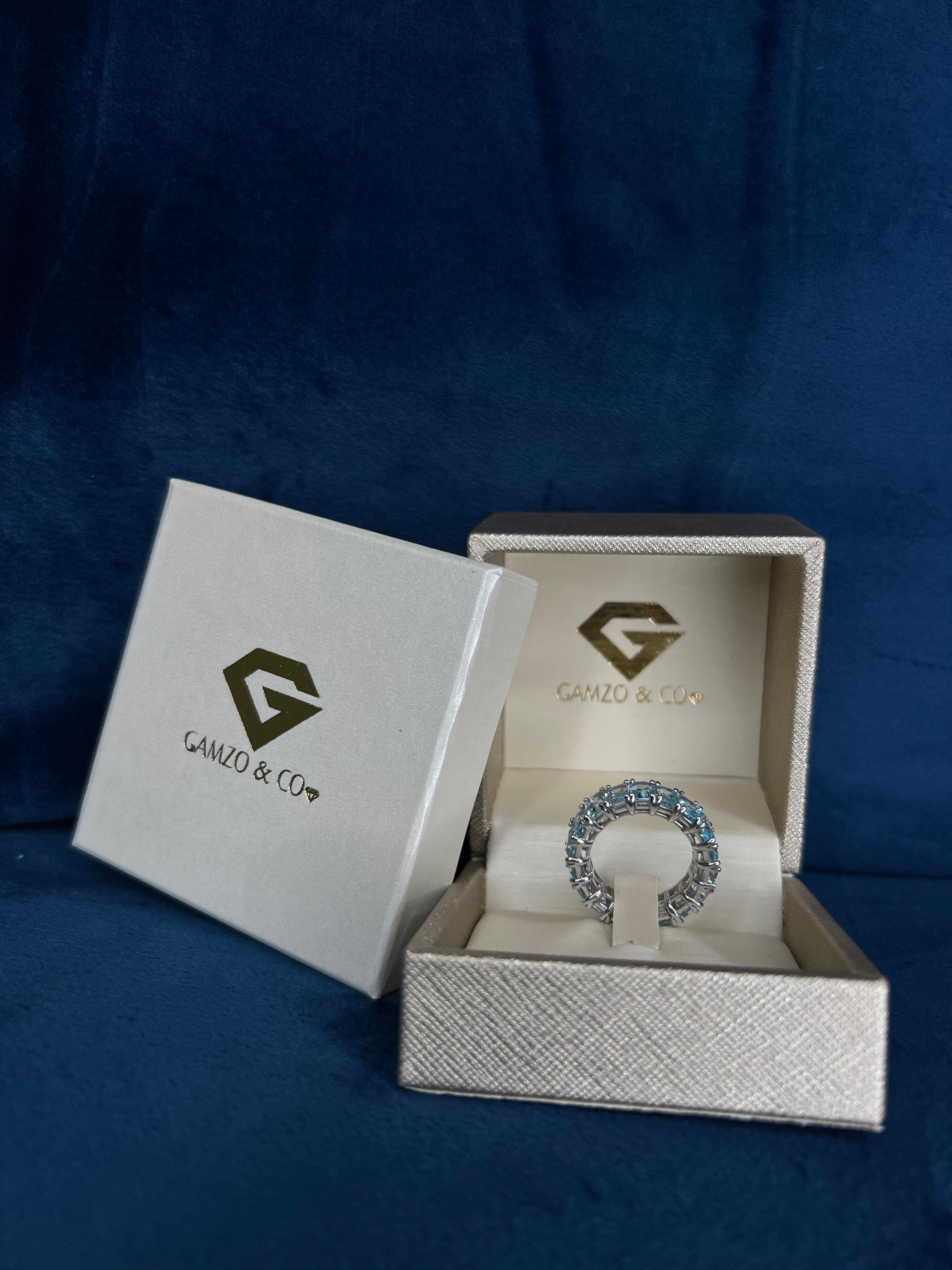 For Sale:  18k White Gold Blue Emerald Cut Topaz Eternity Ring 3
