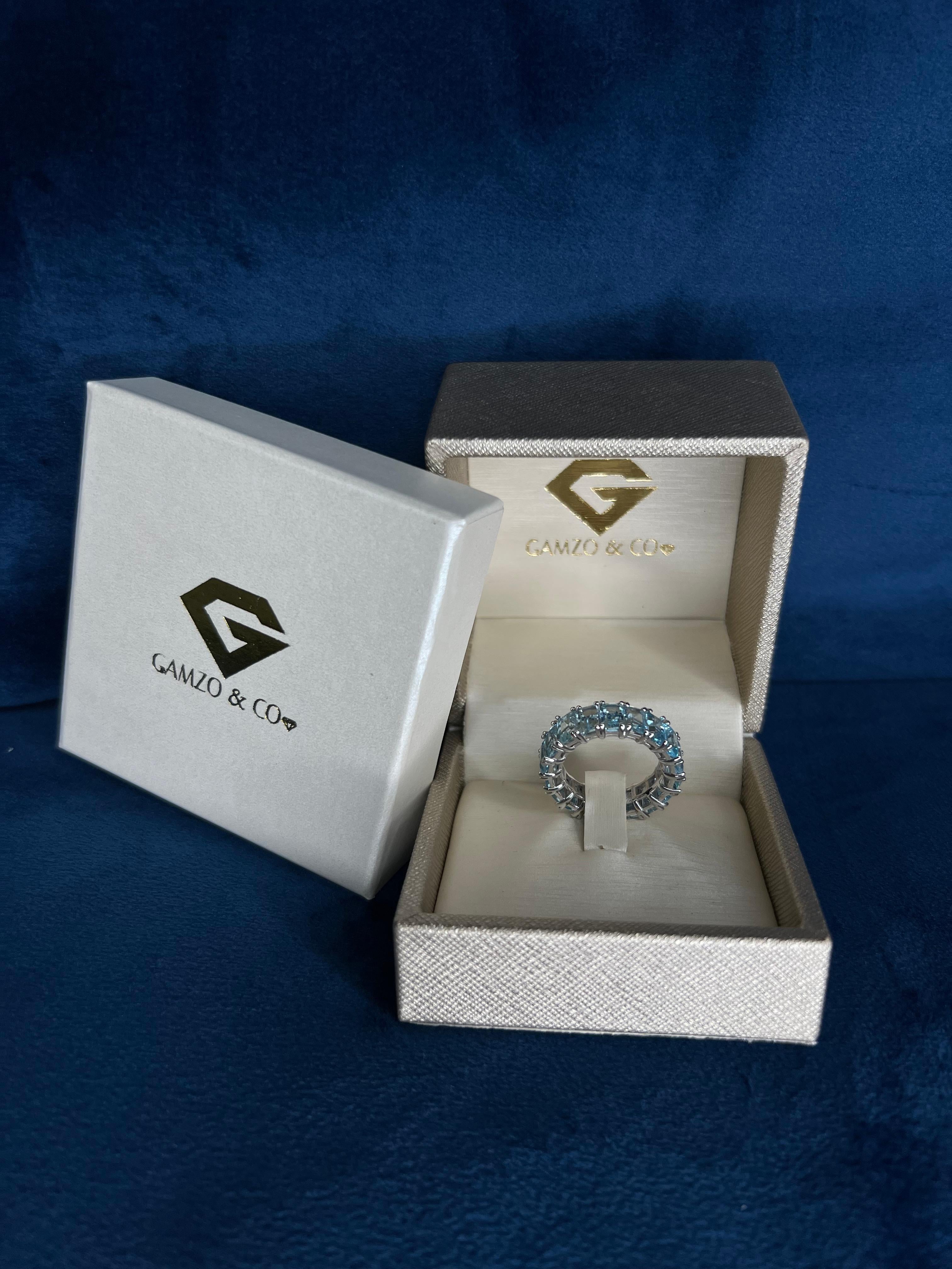 For Sale:  18k White Gold Blue Emerald Cut Topaz Eternity Ring 4
