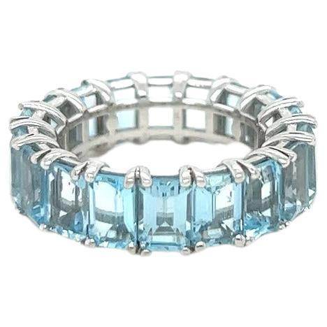For Sale:  18k White Gold Blue Emerald Cut Topaz Eternity Ring