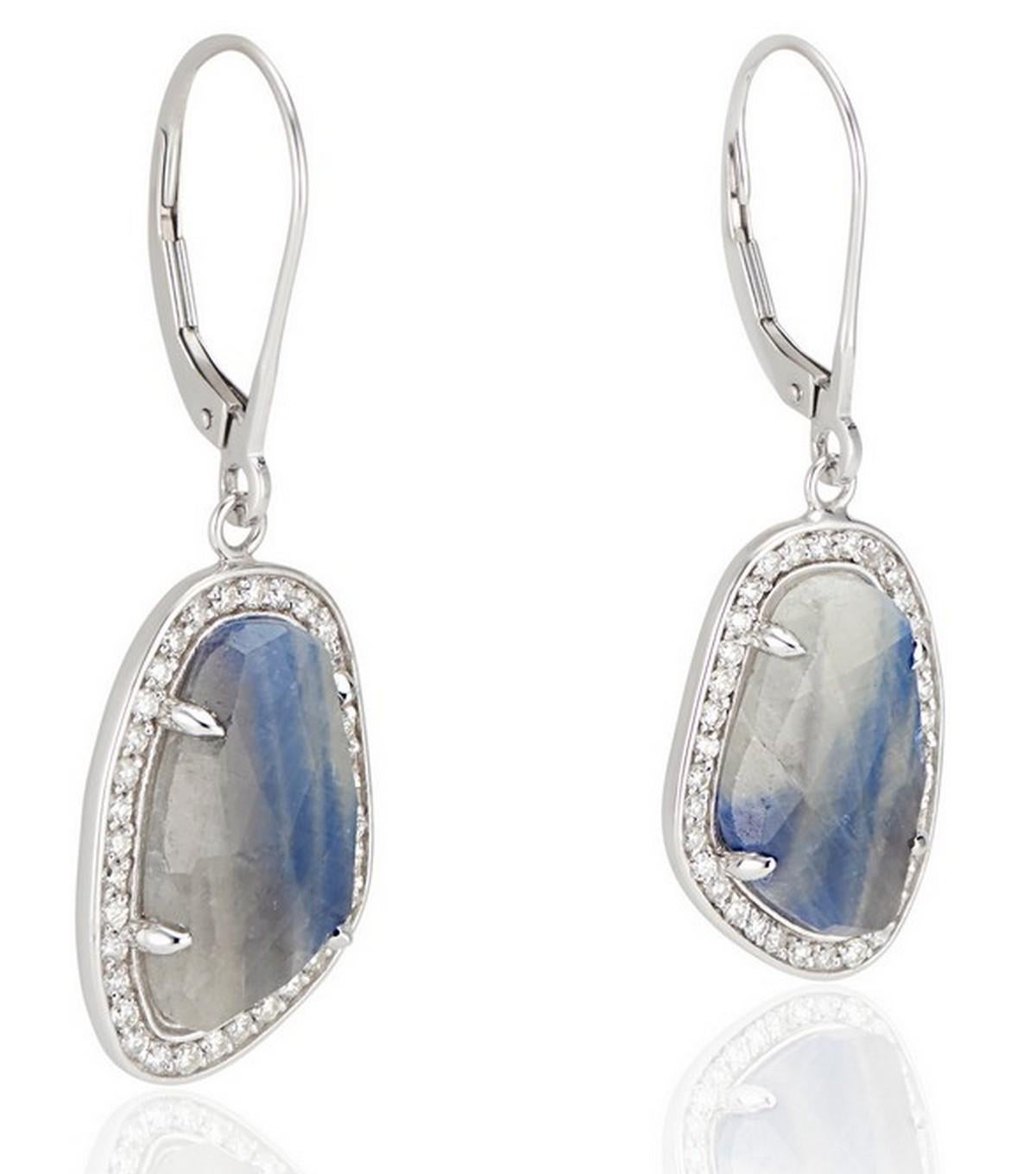 Our one-of-a-kind 18k White Gold Blue Grey Sapphire Slice Earrings offer a subtle luxury that is perfect for everyday wear. Each earring features a captivating slice of natural blue-grey sapphire, carefully cut and polished to highlight its unique