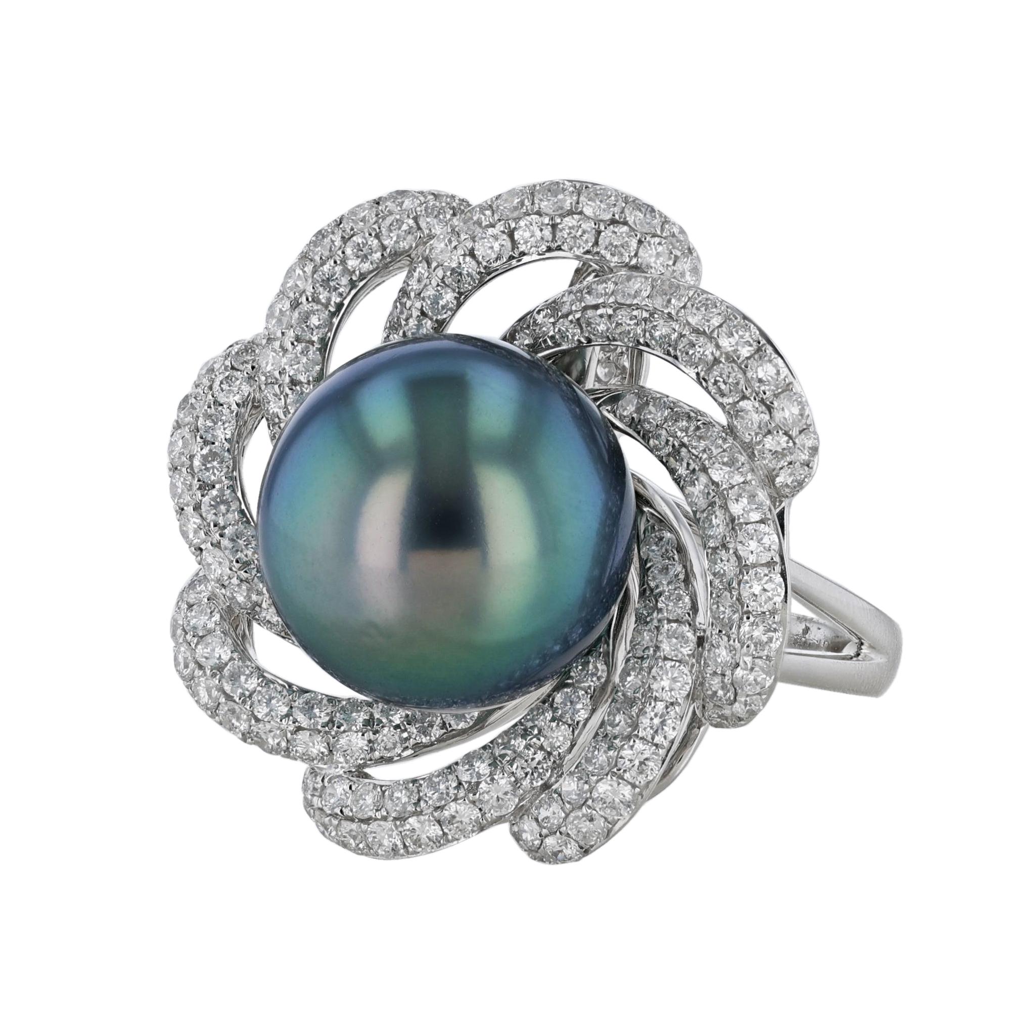 This ring is made in 18K white gold and features a center 14.25 millimeter South Sea Pearl. Surrounded by a floral motif of 176 diamonds weighing 2.13 carats. 
