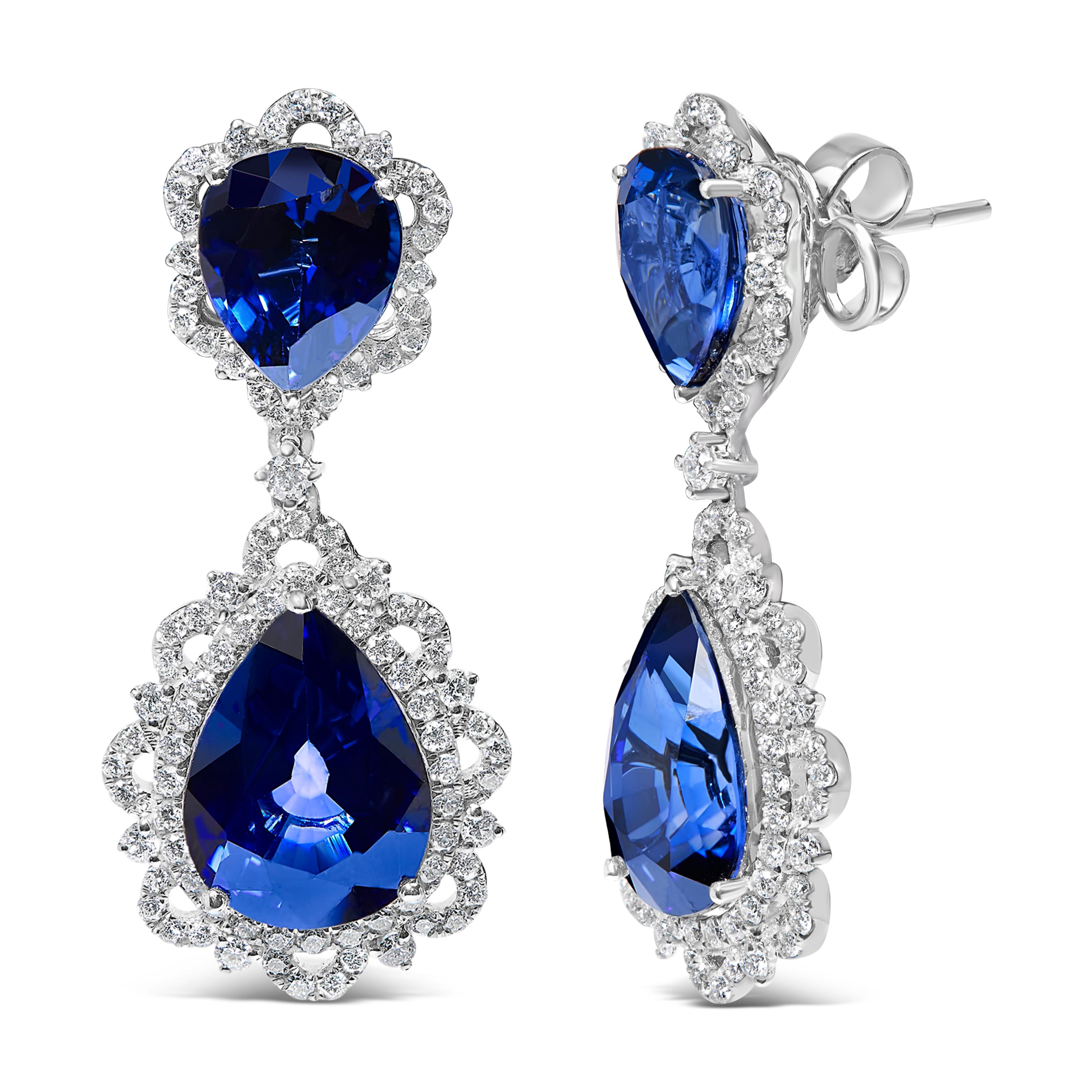Embrace the allure of sophistication with these stunning 18K white gold earrings, adorned with pear-shaped blue sapphires and encircled by halos of dazzling diamonds. With a total diamond weight of 2 carats, the sparkle contrasts beautifully against