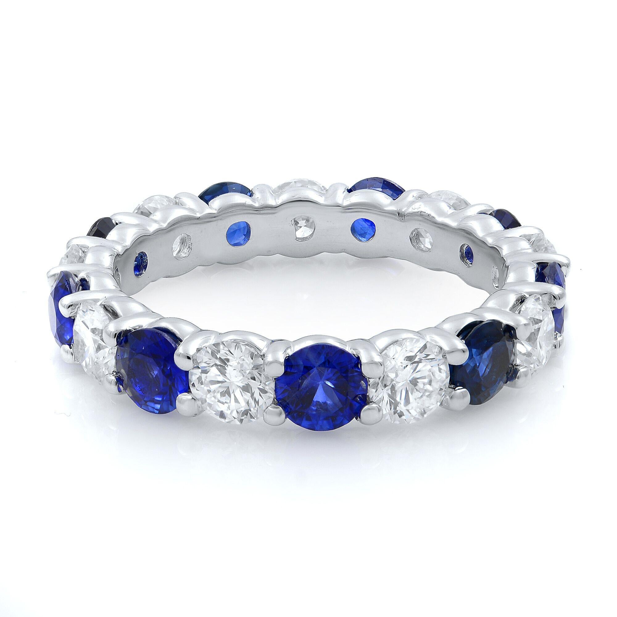 This stunning gemstone eternity band features 9 round blue sapphires alternating with 9 brilliant cut diamonds. The stones are beautifully circling all the way around the band and are set in an elegant 18k white gold shared prong setting.
Wear it as