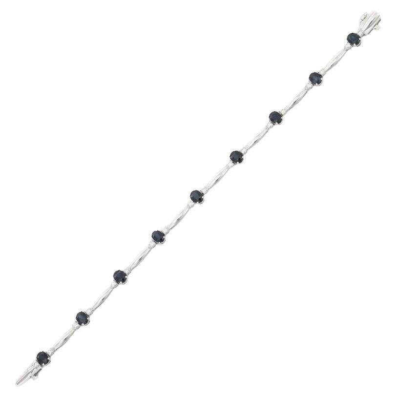 This Sapphire Diamond Tennis Bracelet in 18K gold showcases 9 endlessly sparkling natural sapphires, weighing 4.43 carat and 18 pieces of diamonds weighing 0.69 carat. It measures 7 inches long in length. 
Sapphire stimulate concentration and