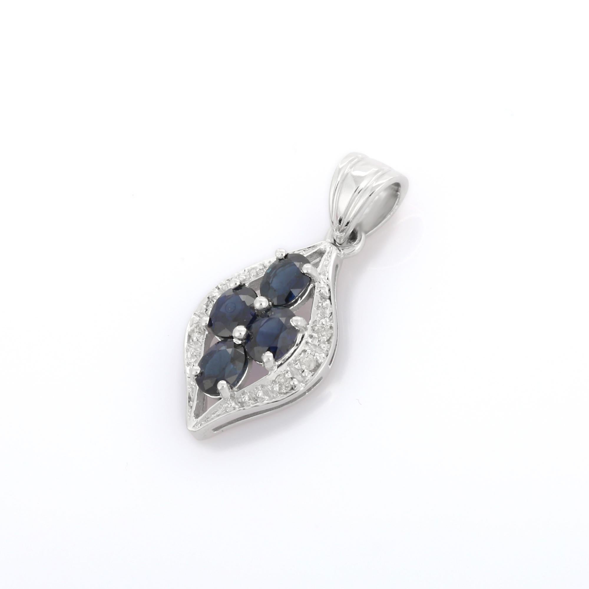 Oval Cut 18K White Gold Deep Blue Sapphire Leaf Pendant with Diamonds For Sale