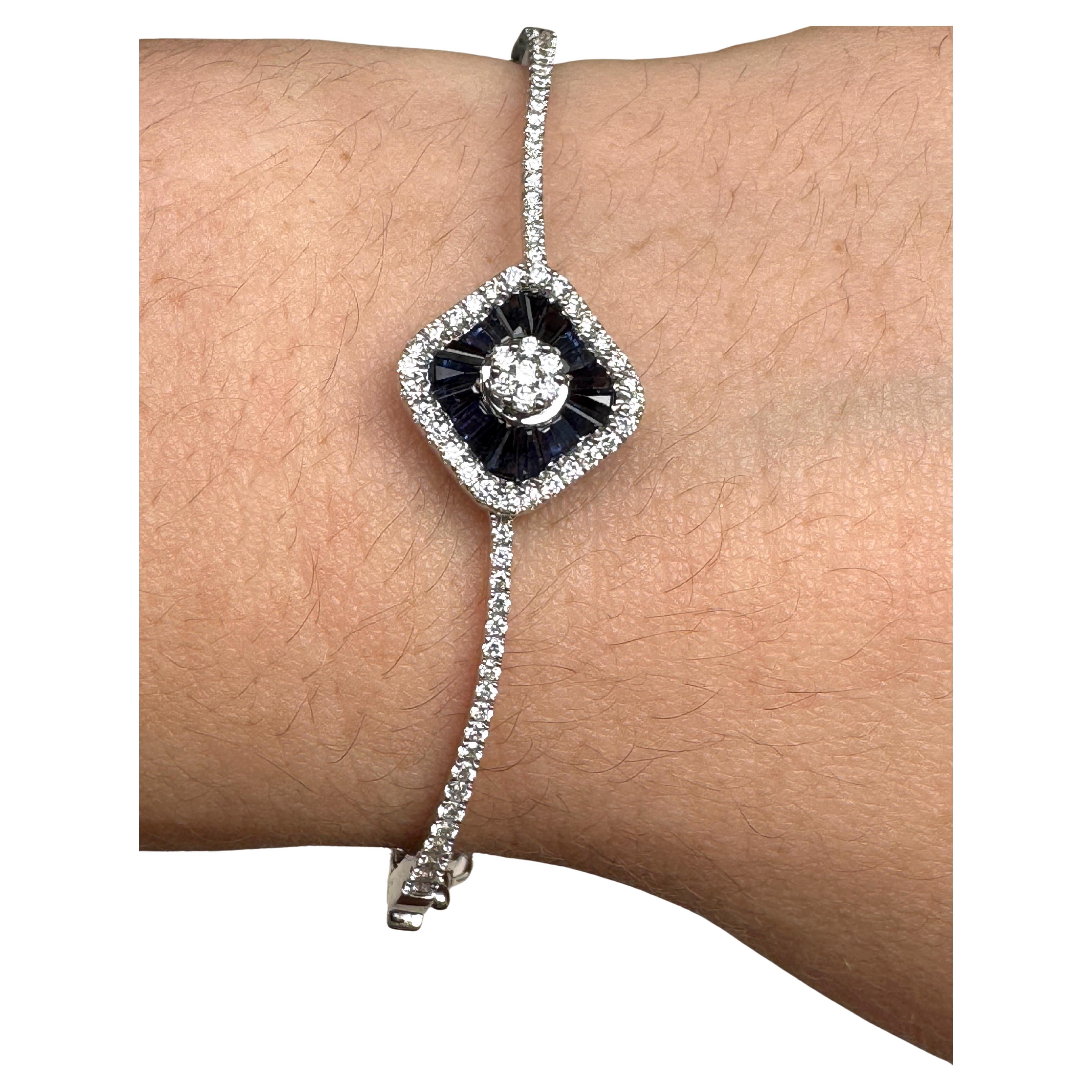 18K White Gold Natural Blue Sapphire Diamond Bangle Bracelet 
Handcrafted, baguette cut sapphire about 1.13 carat and round cut white natural diamond 0.89 carat, Mounted in  in 18K White Gold, center piece about 0.63 inch square. Total weight about