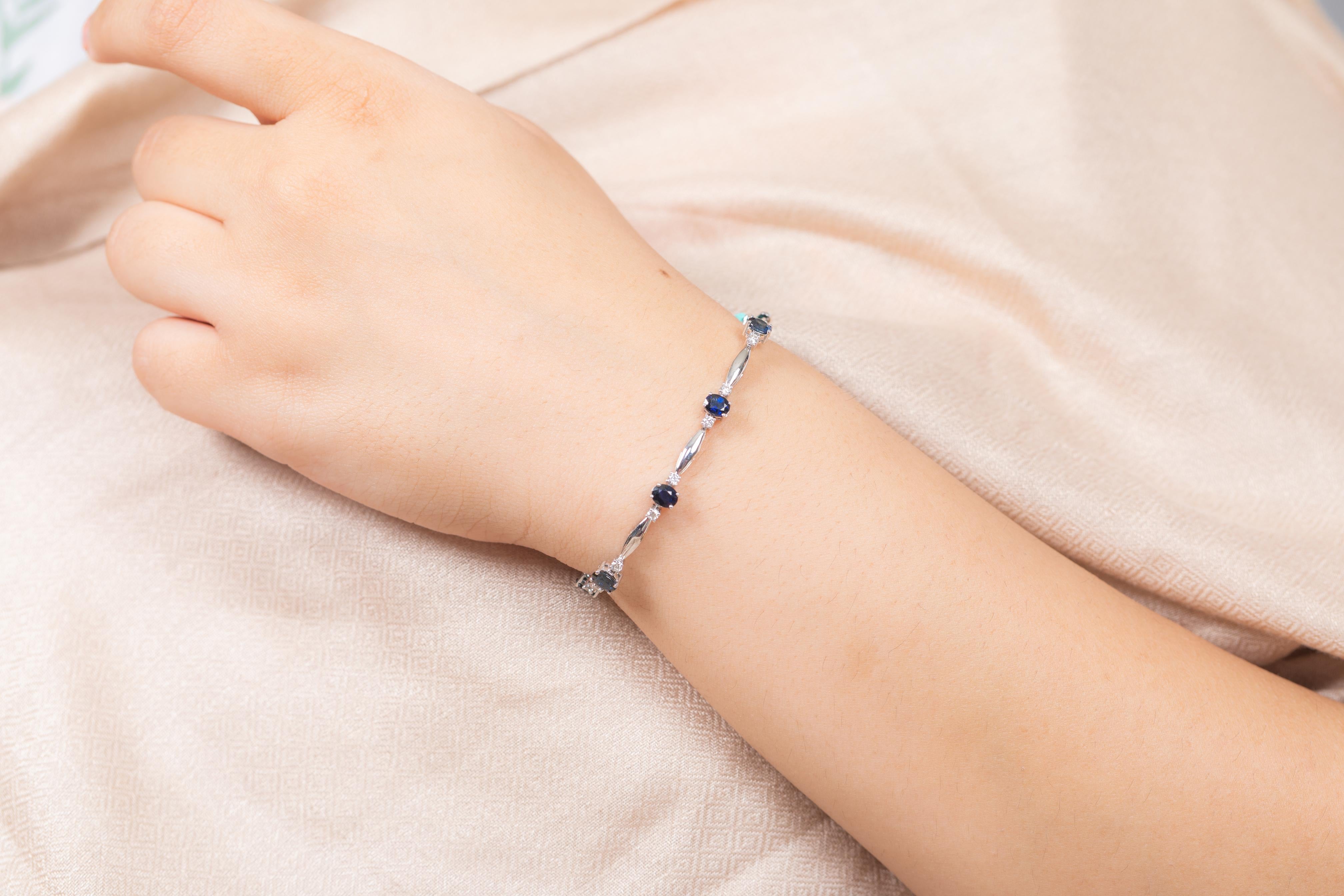The wearing of charms may have begun as a form of amulet or talisman to ward off evil spirits or bad luck.
This blue sapphire bracelet has a oval cut gemstone and diamonds in 18K Gold. A perfect piece of jewelry to adorn your jewelry